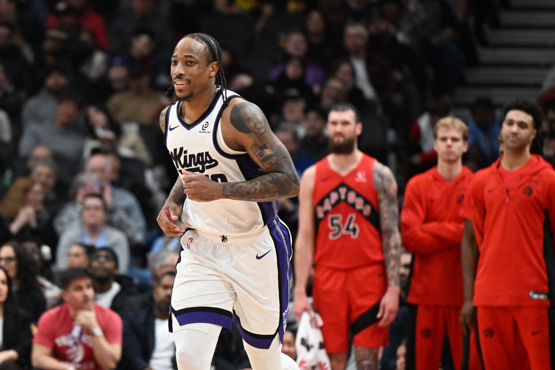 Sacramento Kings forward DeMar DeRozan (10) runs back to defend after sinking a three-point basket from in front of the Toronto Raptors bench in the second half at Scotiabank Arena.