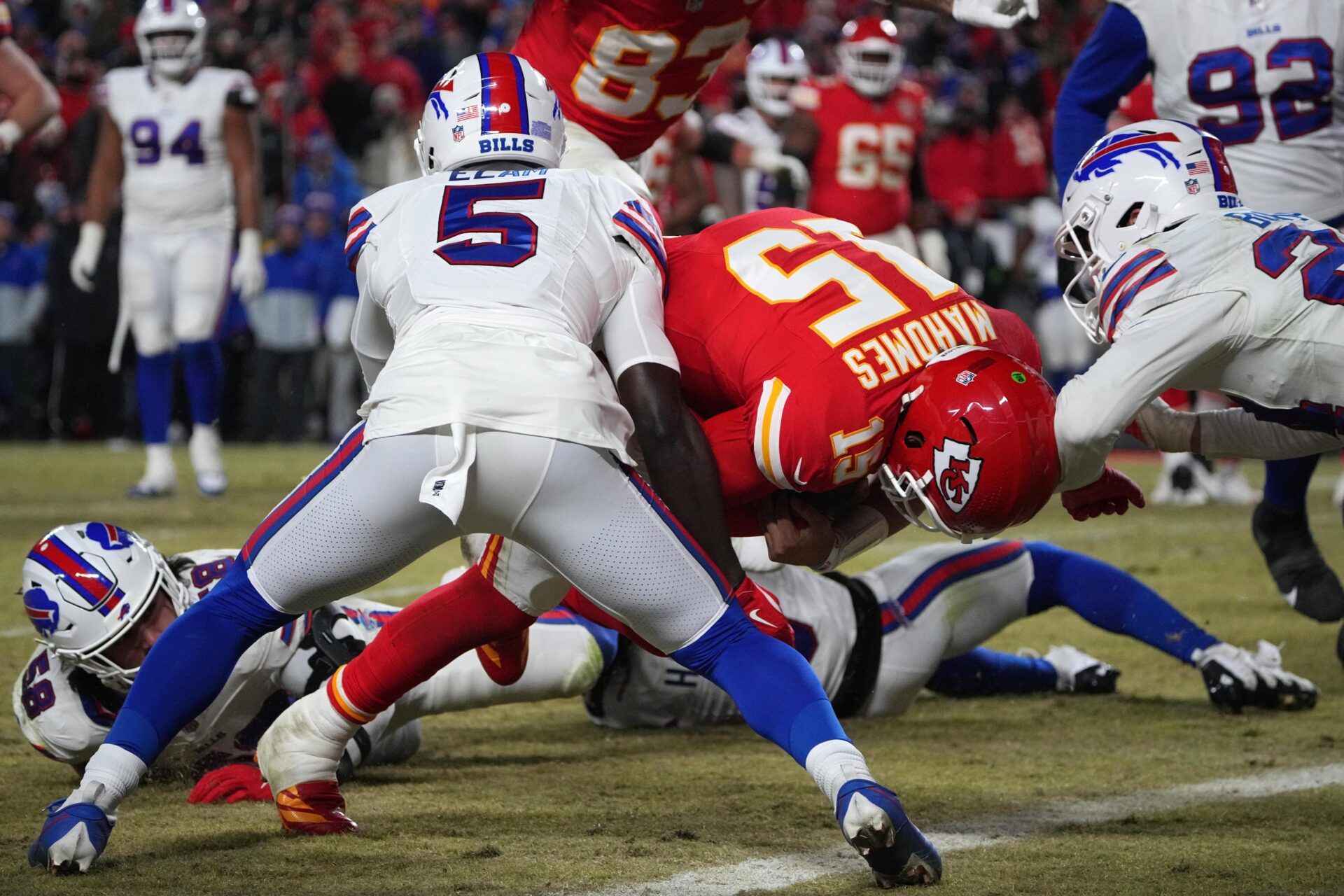 Kansas City Chiefs quarterback Patrick Mahomes (15) dives for a touchdown against Buffalo Bills cornerback Kaiir Elam (5) during the second half in the AFC Championship game at GEHA Field at Arrowhead Stadium.