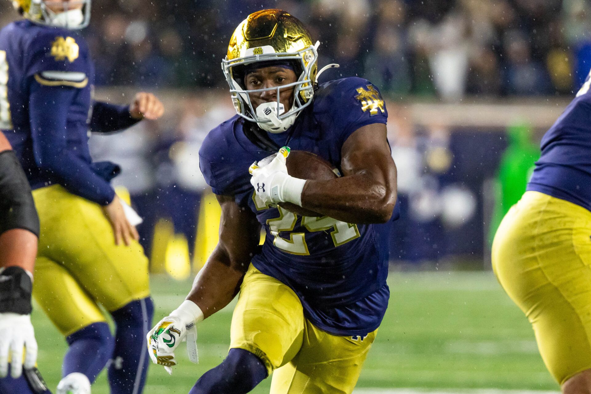 Notre Dame Fighting Irish running back Jadarian Price (24) runs the ball against the Navy Midshipmen during the first half at Notre Dame Stadium.