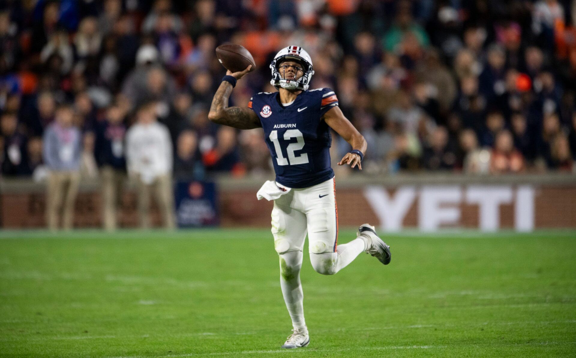 Auburn Tigers quarterback Ashton Daniels (12) pump fakes a pass as Auburn Tigers take on Kentucky Wildcats at Jordan-Hare Stadium in Auburn, Ala. on Saturday, Nov. 1, 2025. Auburn Tigers and Kentucky Wildcats are tied 3-3 at halftime.