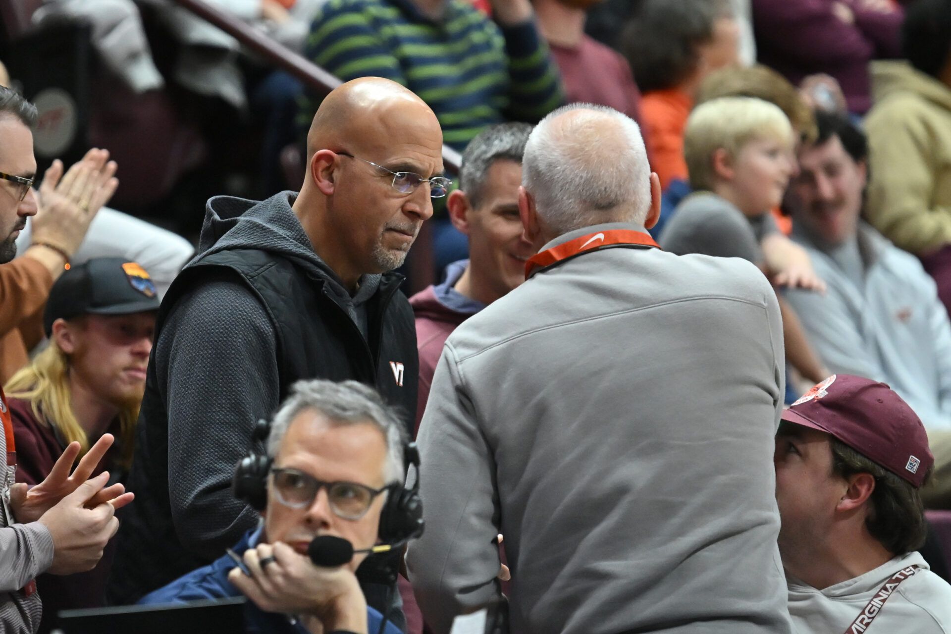 Virginia Tech head football coach James Franklin talks to a fan during the first half at Cassell Coliseum.