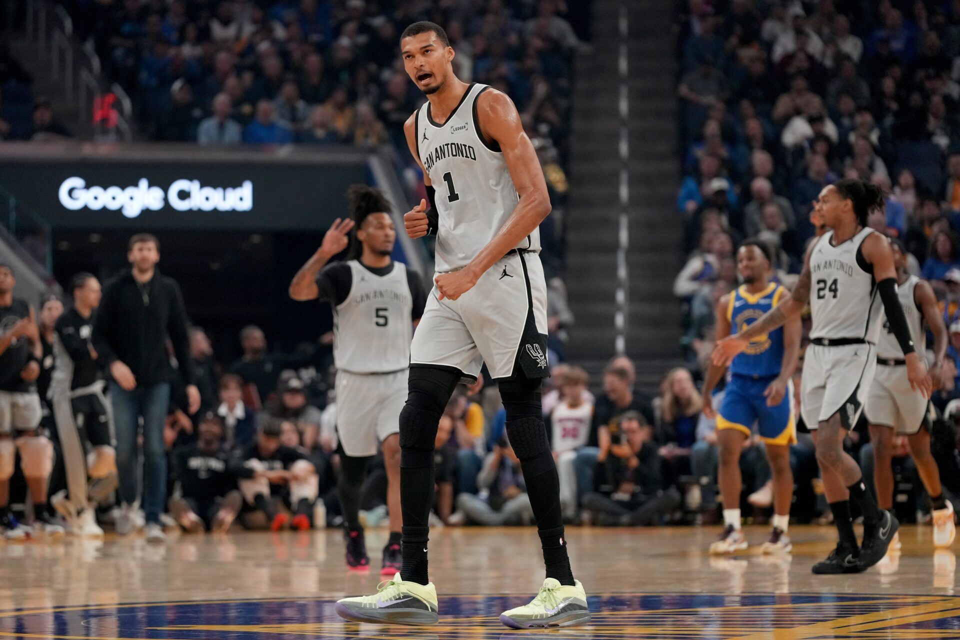 San Antonio Spurs center Victor Wembanyama (1) reacts after the Spurs made a three point basket against the Golden State Warriors in the first quarter at the Chase Center.