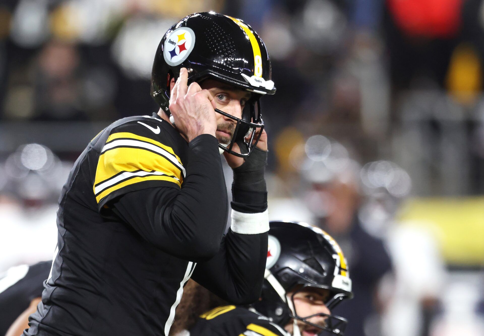 Pittsburgh Steelers quarterback Aaron Rodgers (8) audibles during the second half of an AFC Wild Card Round game against the Houston Texans at Acrisure Stadium.