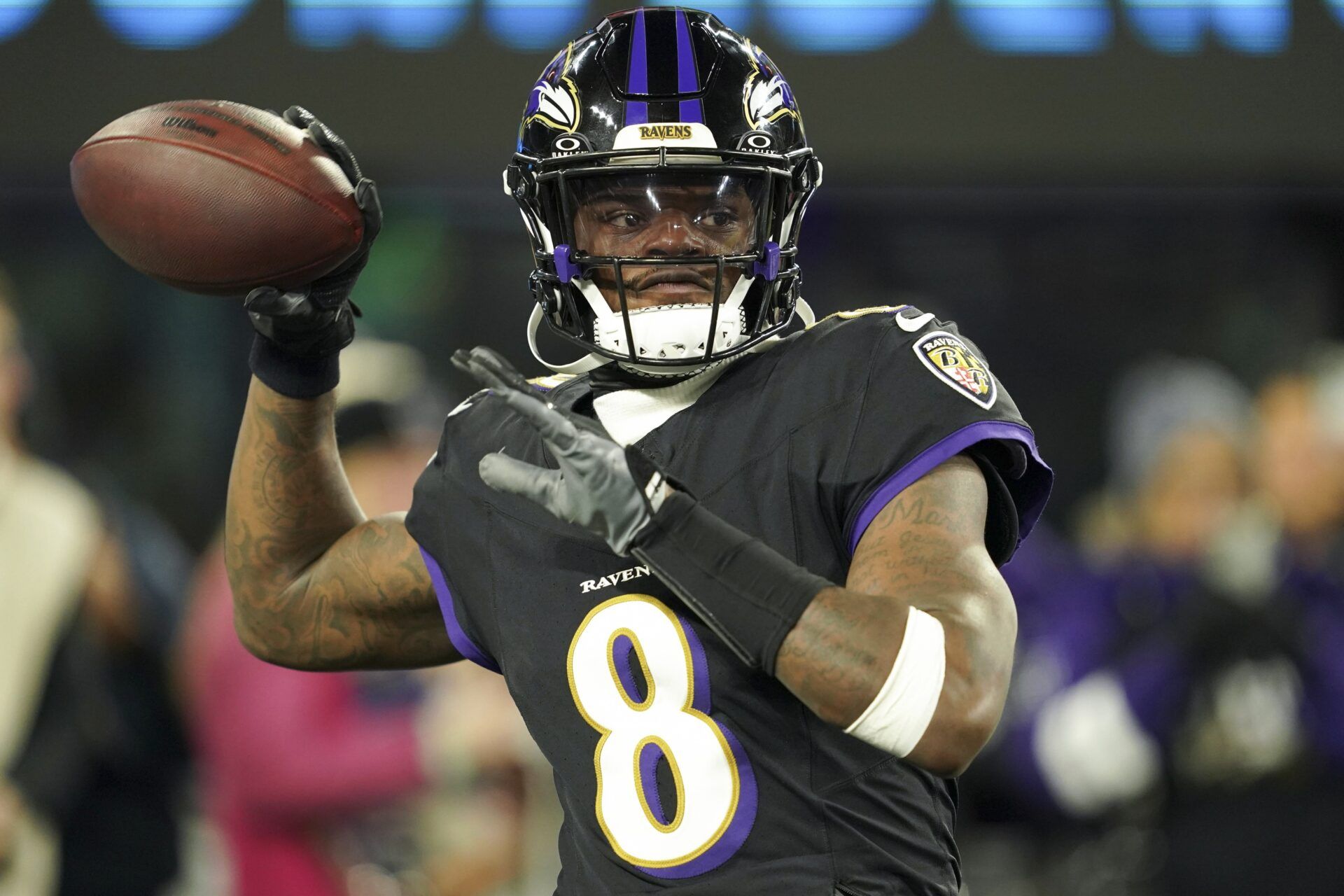 Baltimore Ravens quarterback Lamar Jackson (8) warms up prior to the game against the New England Patriots at M&T Bank Stadium.