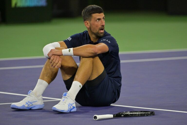 Novak Djokovic (SRB) takes a moment on the court after a long rally during his fourth round match against Jack Draper (GBR) in the BNP Paribas Open at the Indian Wells Tennis Garden.
