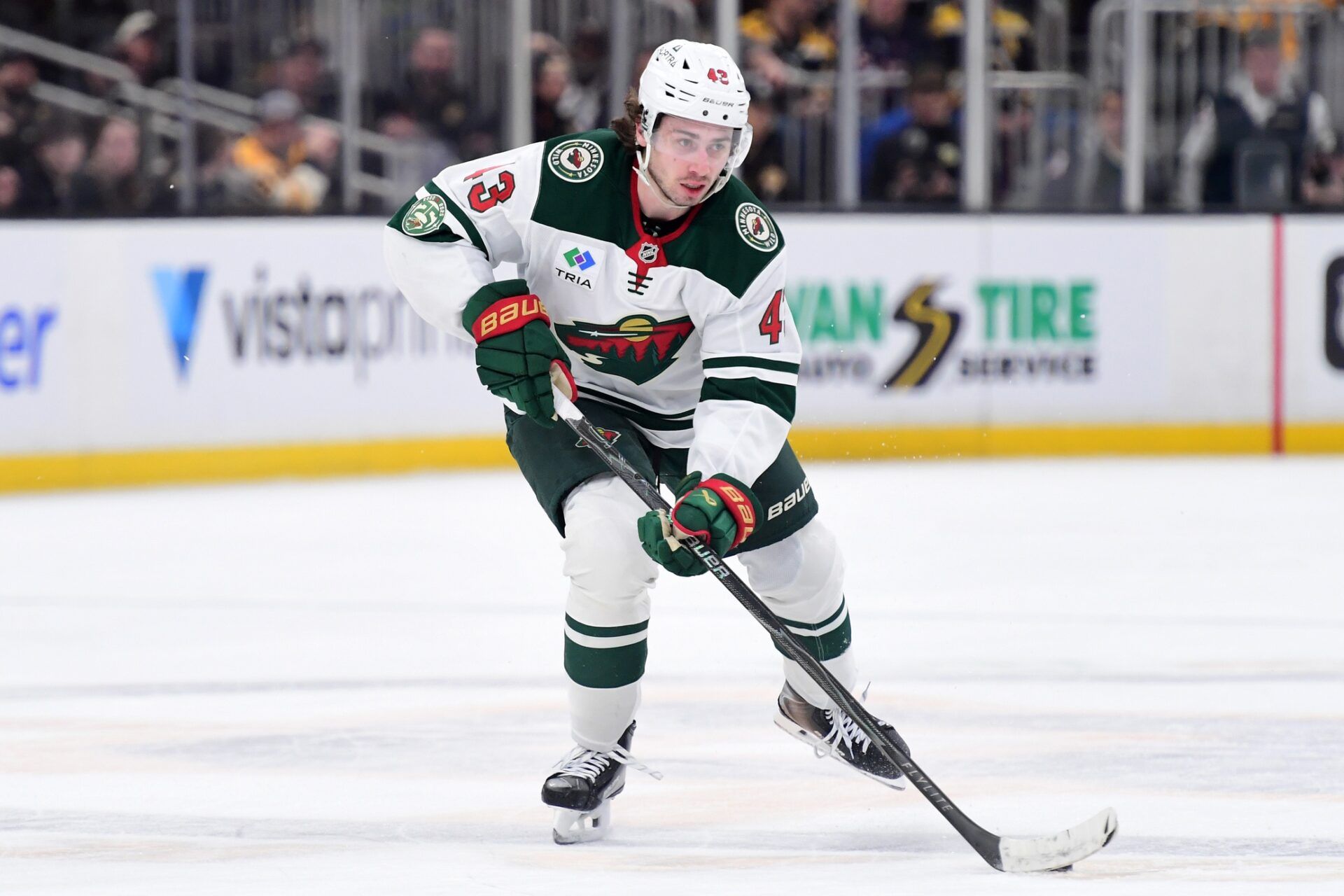 Minnesota Wild defenseman Quinn Hughes (43) skates with the puck during the second period against the Boston Bruins at TD Garden.