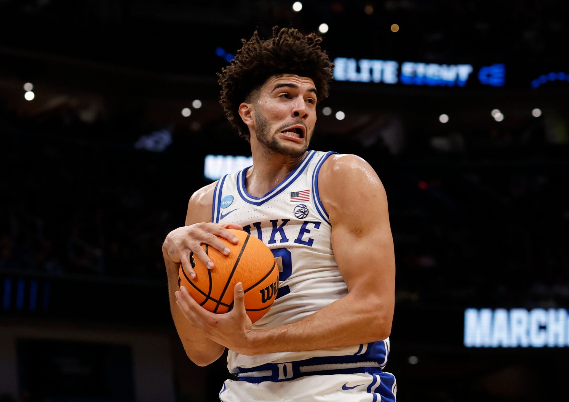 Duke Blue Devils forward Cameron Boozer (12) rebounds the ball against the UConn Huskies in the first half during an Elite Eight game of the East Regional of the men's 2026 NCAA Tournament at Capital One Arena.