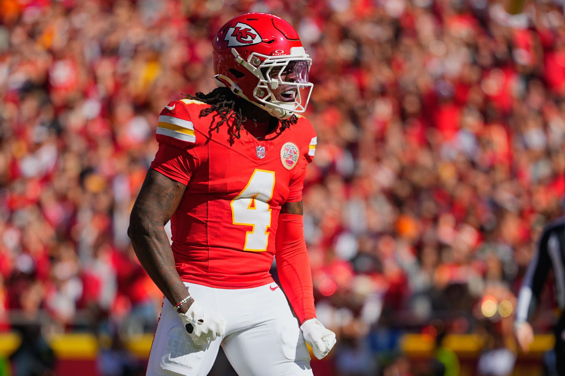 Kansas City Chiefs wide receiver Rashee Rice (4) celebrates after scoring a touchdown against the Las Vegas Raiders during the first quarter of the game at GEHA Field at Arrowhead Stadium.