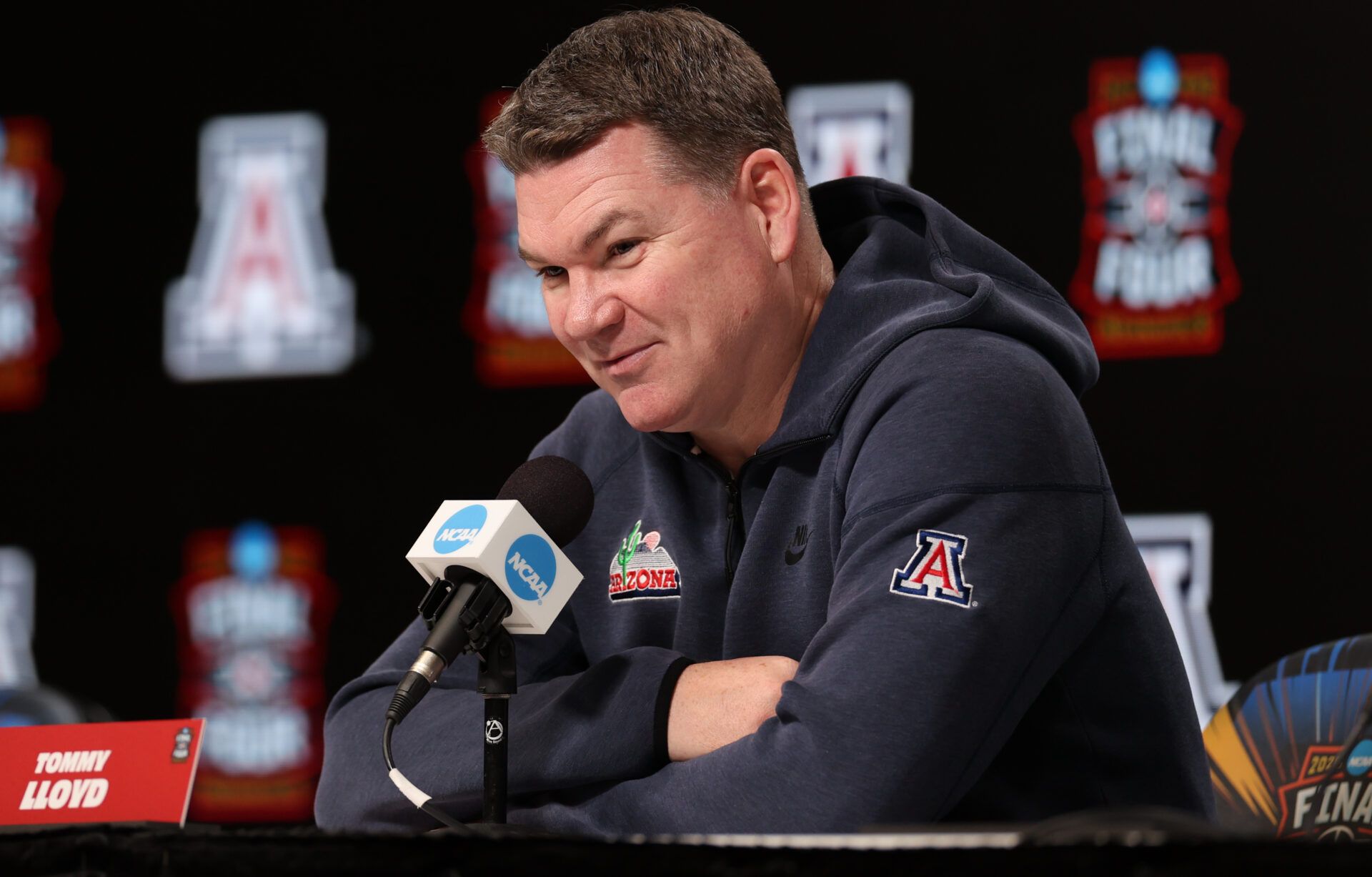 Arizona Wildcats head coach Tommy Lloyd speaks during a press conference ahead of the Final Four of the men's 2026 NCAA Tournament at Lucas Oil Stadium.