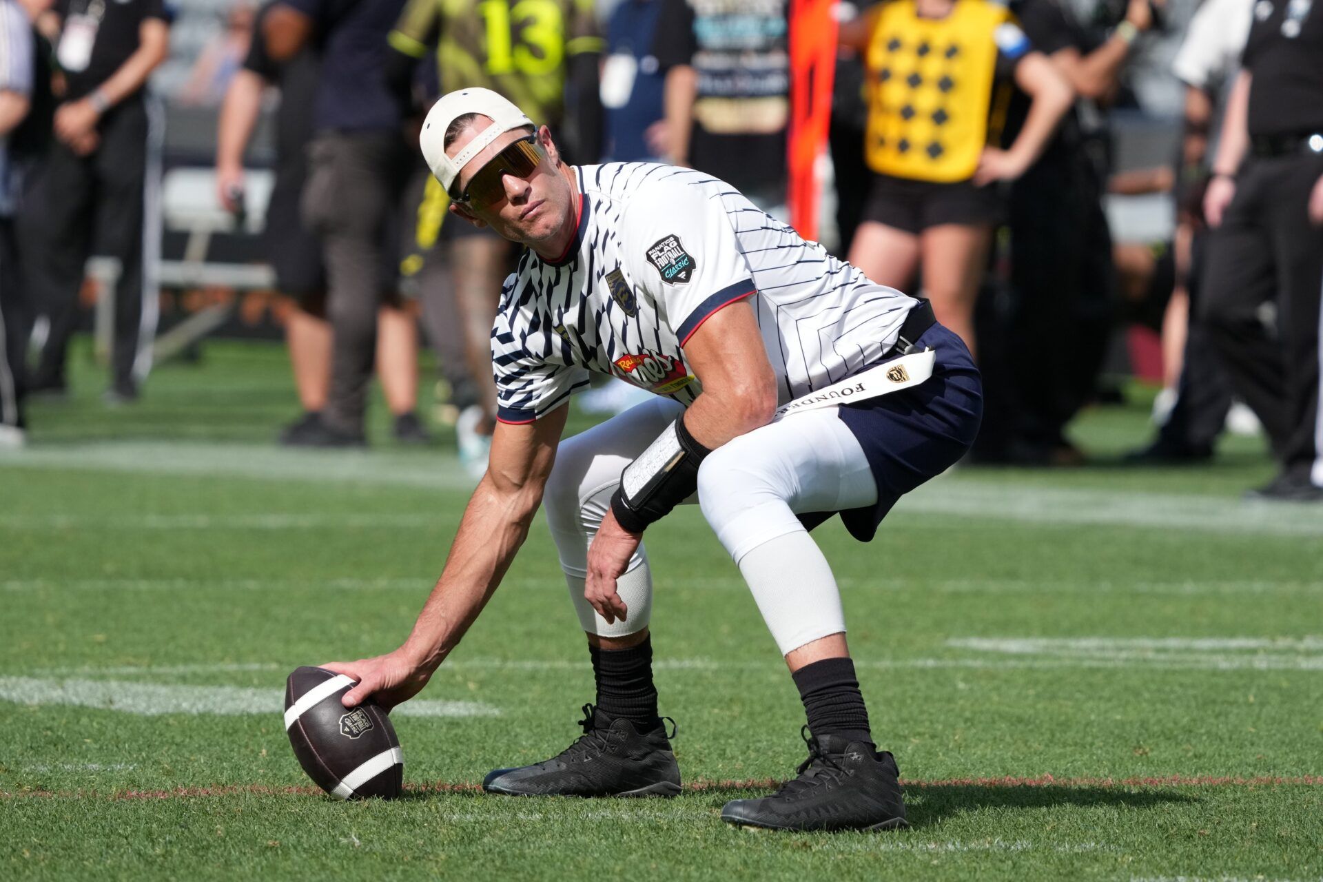 Founders FFC quarterback Tom Brady (12) hikes the ball during the Fanatics Flag Football Classic at BMO stadium.