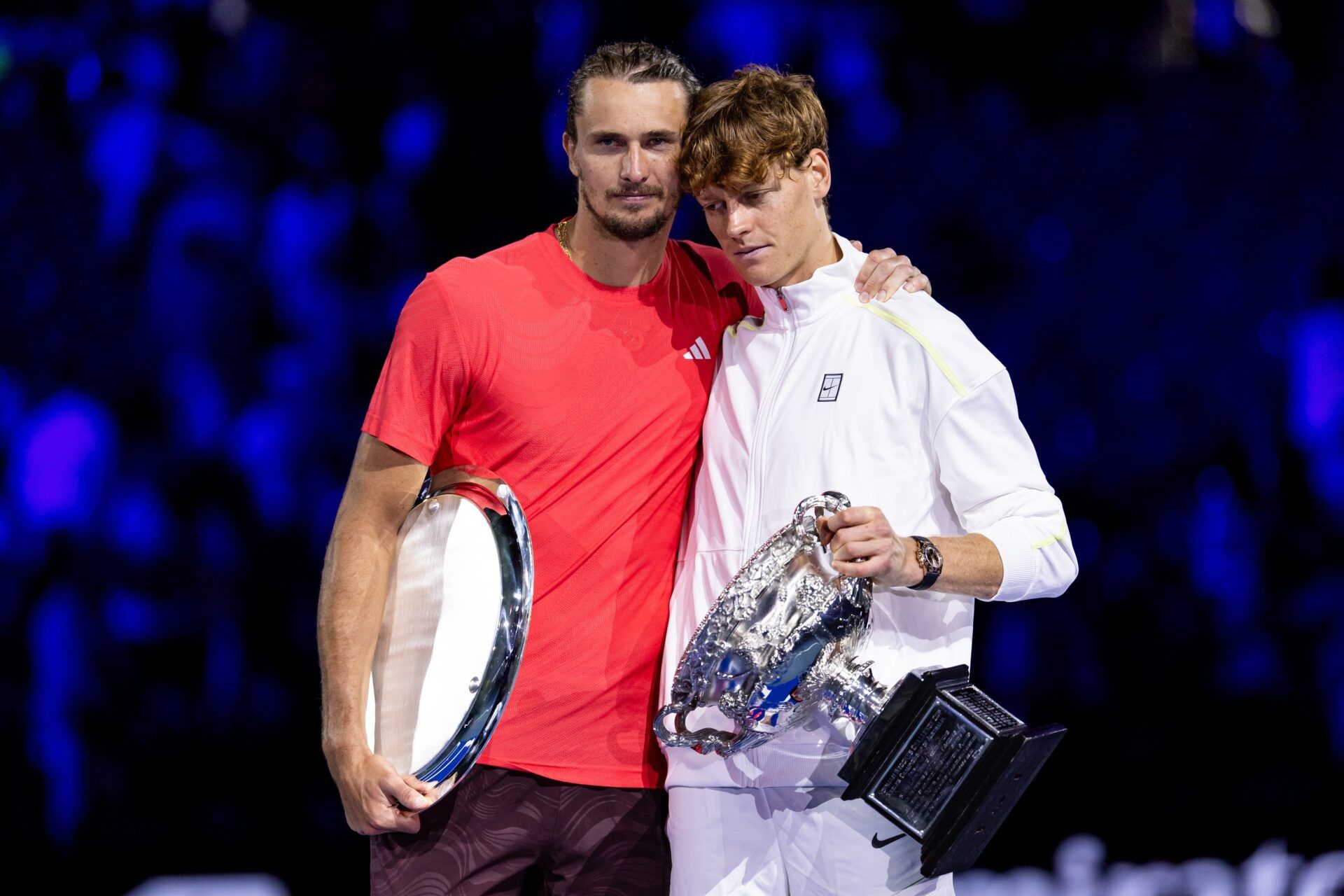 Jannik Sinner of Italy and Alexander Zverev of Germany share a moment during the prize presentation of the men's single final at the 2025 Australian Open at Melbourne Park.