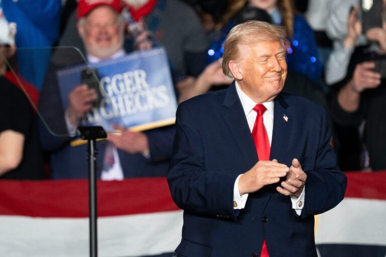 President Donald Trump takes the stage during a rally at Horizon Events Center on Tuesday, Jan. 27, 2026 in Clive.