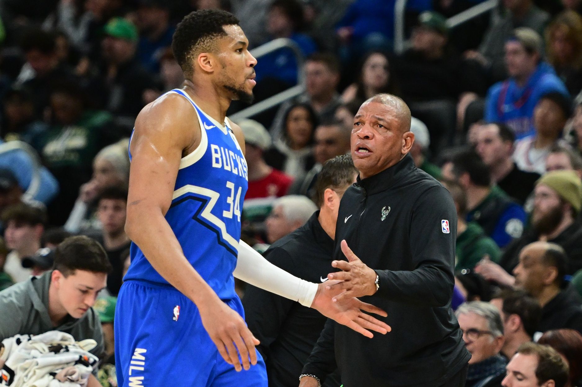 Milwaukee Bucks forward Giannis Antetokounmpo (34) walks past  head coach Doc Rivers in the third quarter against the Oklahoma City Thunder at Fiserv Forum.