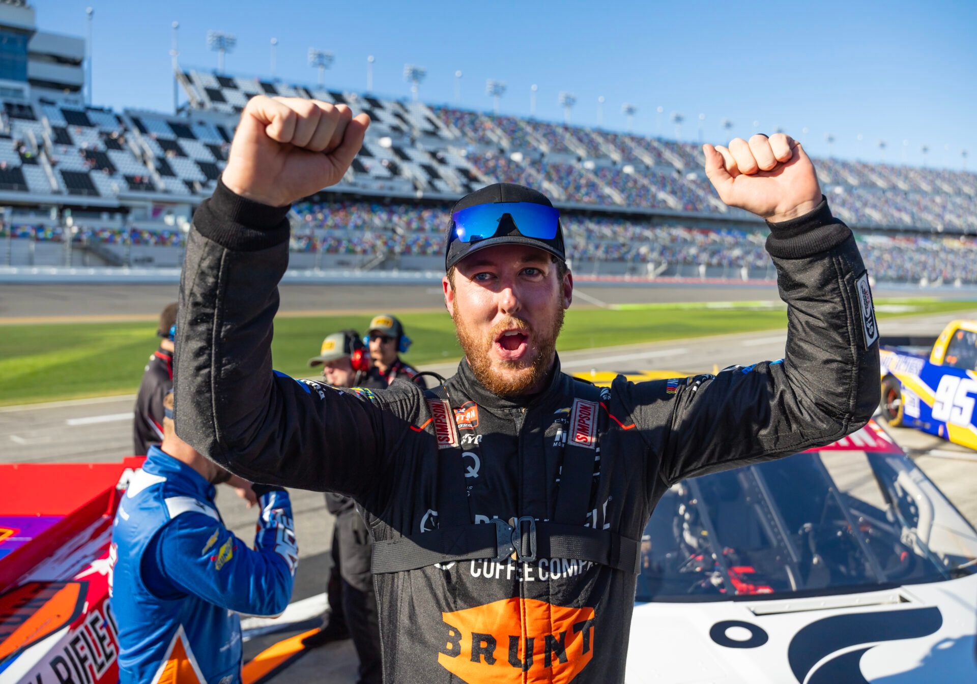 NASCAR Truck Series driver Garrett Mitchell celebrates during qualifying for the Fresh from Florida 250 at Daytona International Speedway.