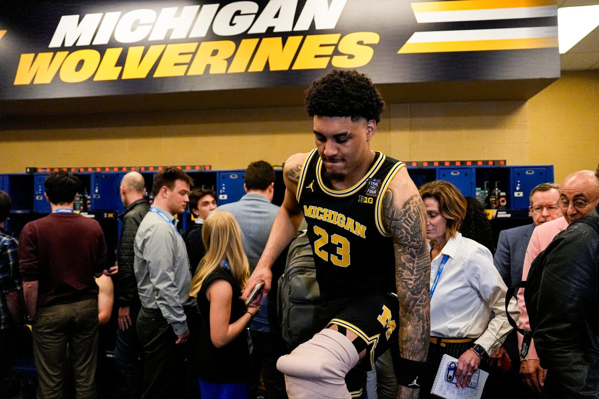Michigan forward Yaxel Lendeborg (23) walks over a bag in the locker room after 91-72 win over Arizona at the Final Four game at Lucas Oil Stadium in Indianapolis on Saturday, April 4, 2026.