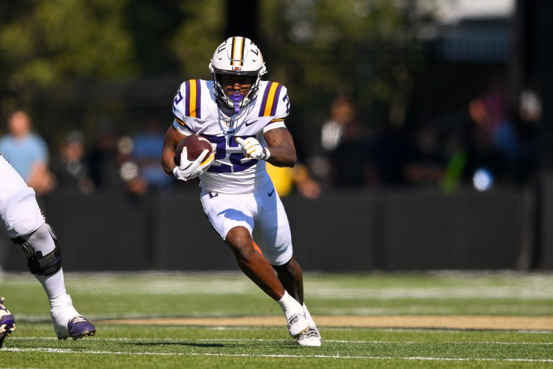 Louisiana State Tigers running back Harlem Berry (22) runs with the ball against the Vanderbilt Commodores during the first half at FirstBank Stadium.