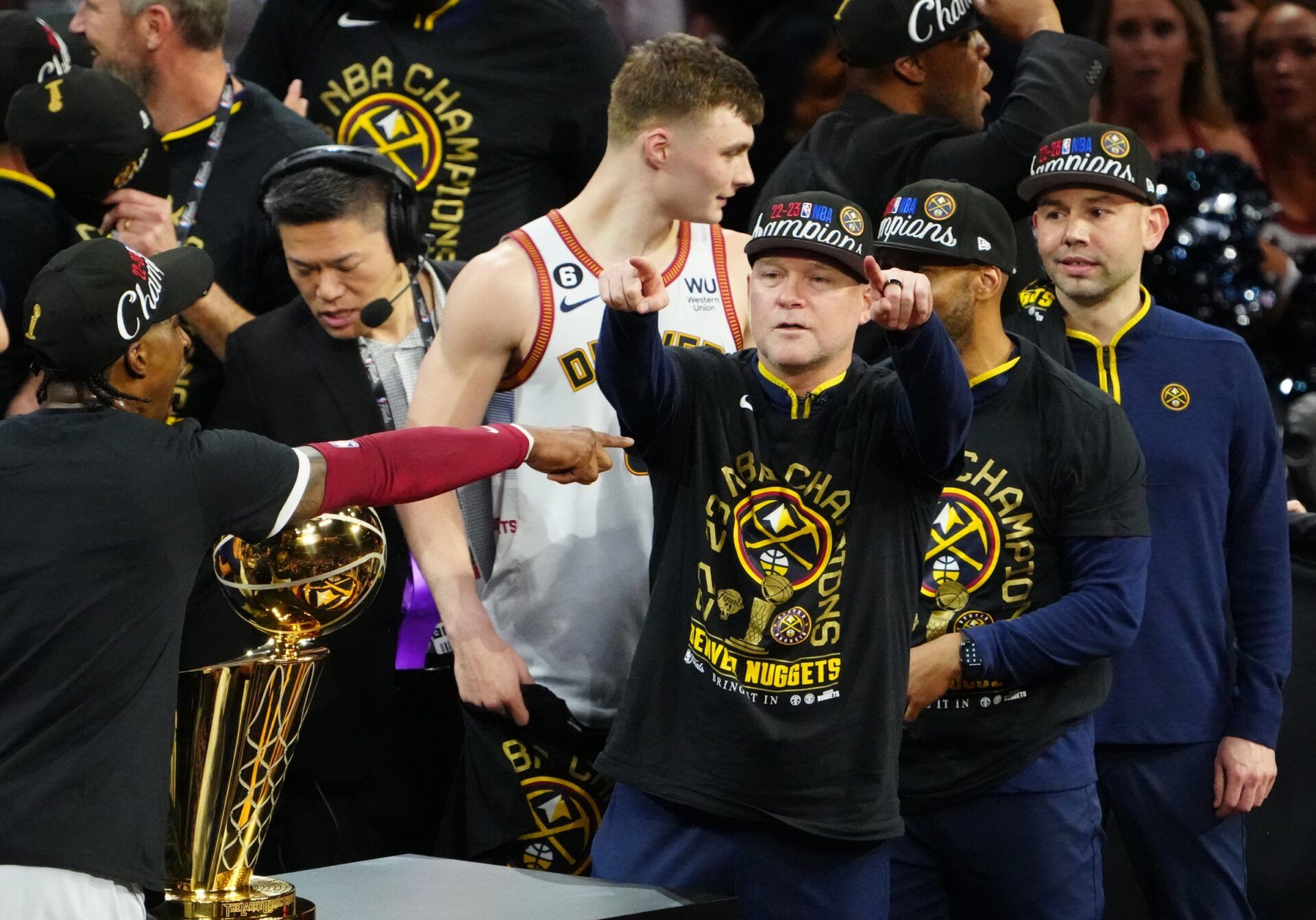 Denver Nuggets head coach Michael Malone celebrates after winning the 2023 NBA Championship against the Miami Heat at Ball Arena.