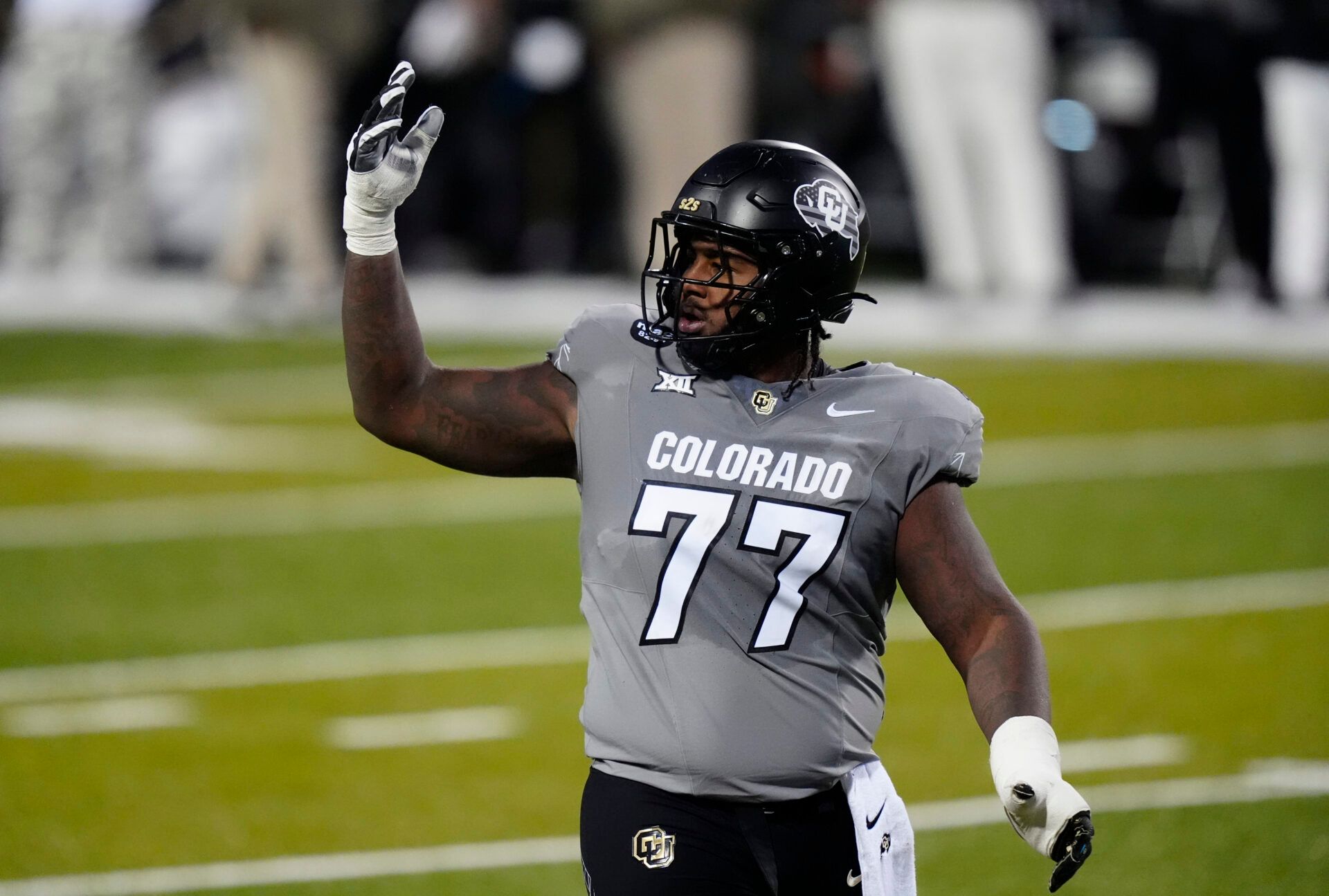 Colorado Buffaloes offensive lineman Jordan Seaton (77) reacts to a penalty called during the second quarter against the Arizona Wildcats at Folsom Field.