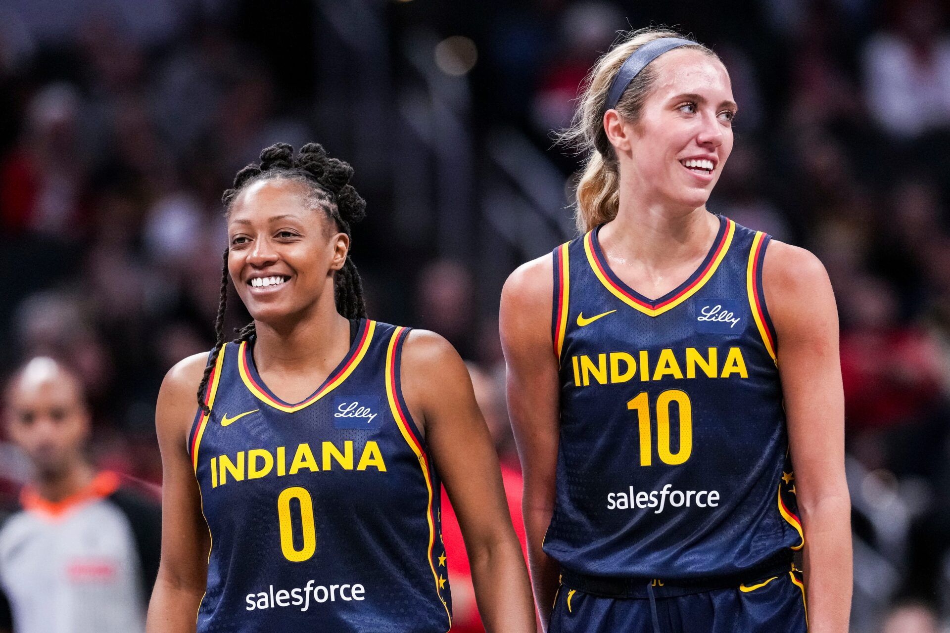Indiana Fever Kelsey Mitchell (0) and Indiana Fever Lexie Hull (10) smile Saturday, May 3, 2025, during a free throw at a preseason game between the Indiana Fever and the Washington Mystics at Gainbridge Fieldhouse in Indianapolis.