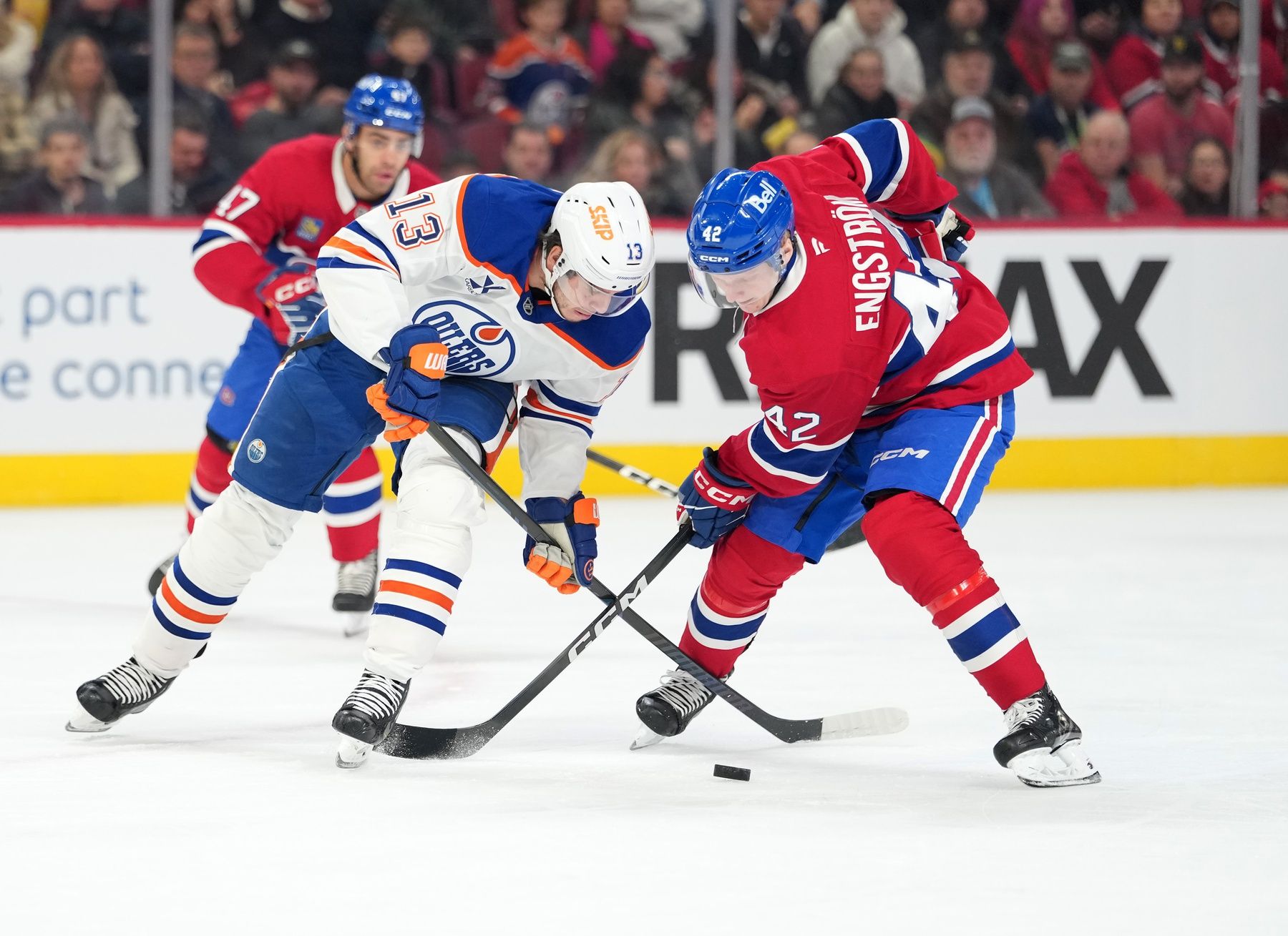 Edmonton Oilers forward Mattias Janmark (13) and Montreal Canadiens defenseman Adam Engstrom (42) battle for the puck during the first period at the Bell Centre.