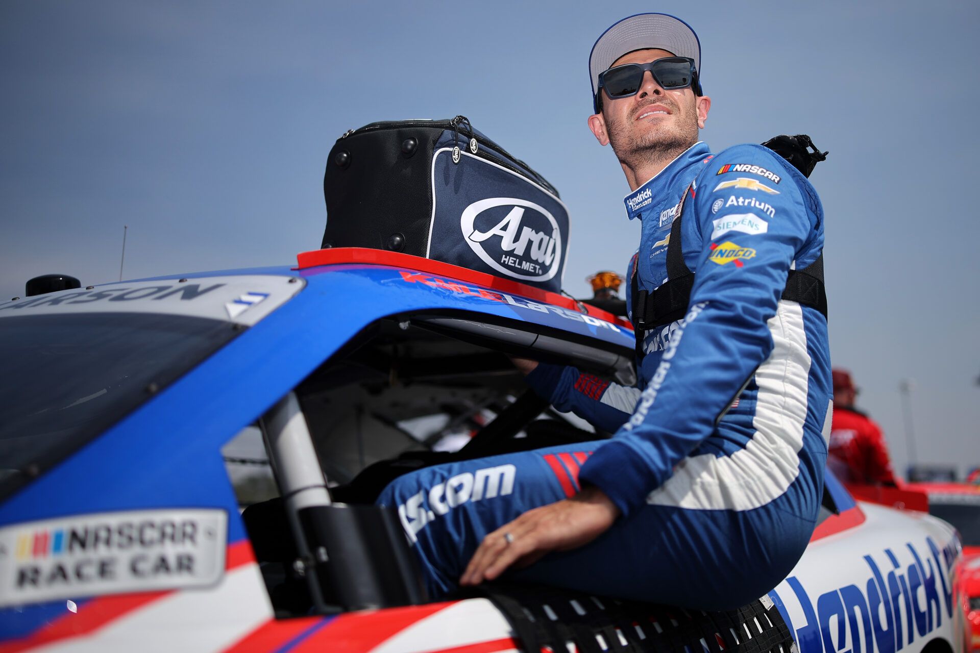 DARLINGTON, SOUTH CAROLINA - MARCH 21: Kyle Larson, driver of the #88 HendrickCars.com Chevrolet, enters his car during qualifying for the NASCAR O'Reilly Auto Parts Series Sport Clips Haircuts VFW Help a Hero 200 at Darlington Raceway on March 21, 2026 in Darlington, South Carolina. (Photo by Jonathan Bachman/Getty Images)