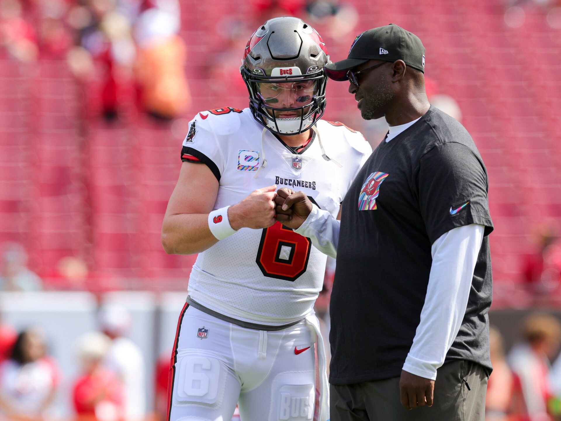 Tampa Bay Buccaneers quarterback Baker Mayfield (6) speaks to head coach Todd Bowles before a game against the Atlanta Falcons at Raymond James Stadium.