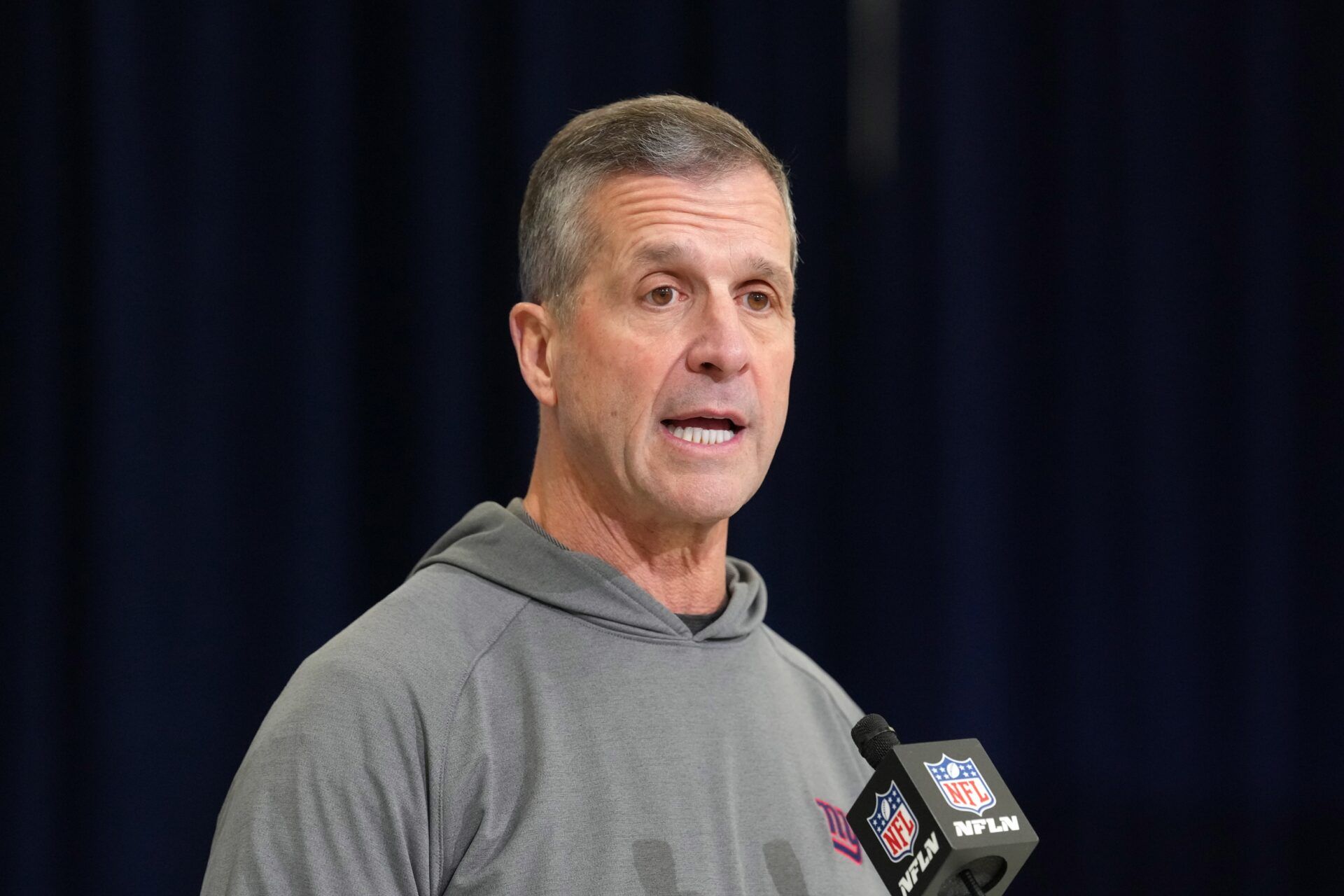 New York Giants coach John Harbaugh speaks at the NFL Scouting Combine at the Indiana Convention Center.