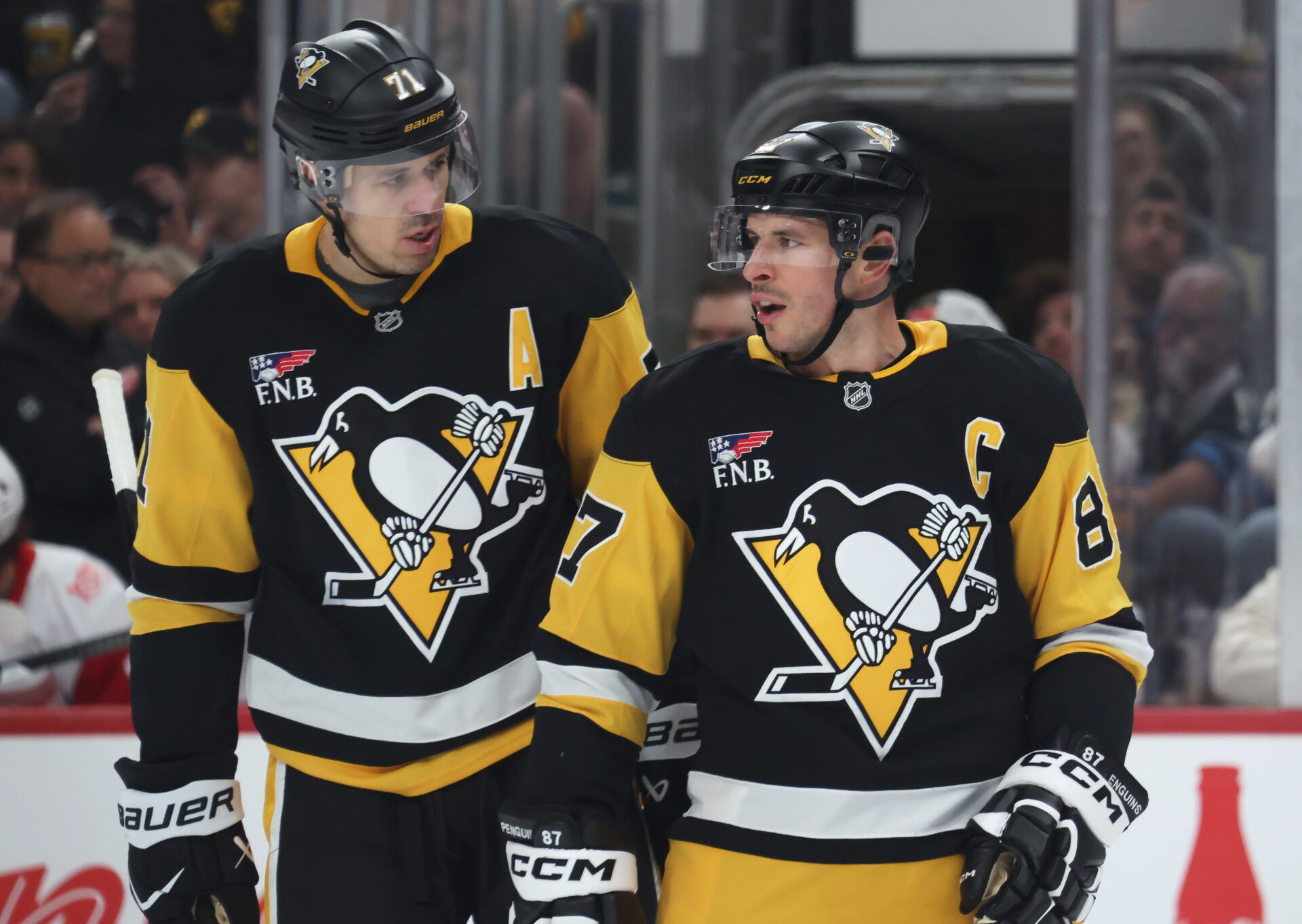 Pittsburgh Penguins center Evgeni Malkin (71) and center Sidney Crosby (87) talk on the ice against the Detroit Red Wings during the first period at PPG Paints Arena.
