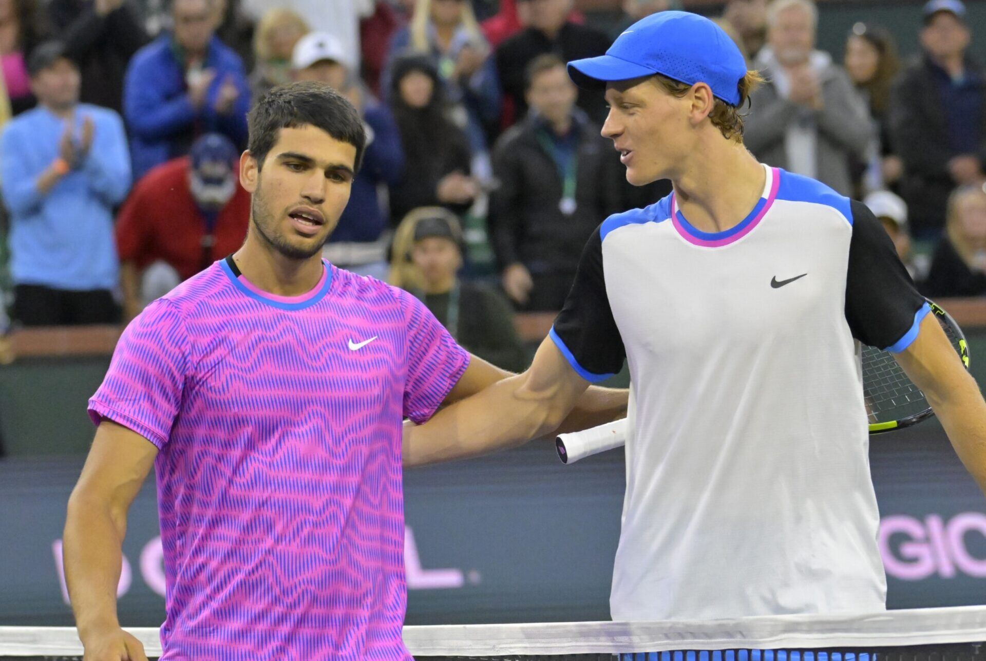 Carlos Alcaraz (ESP) is congratulated by Jannik Sinner (POL) after winning their semi-final match in the BNP Paribas Open at the Indian Wells Tennis Garden.