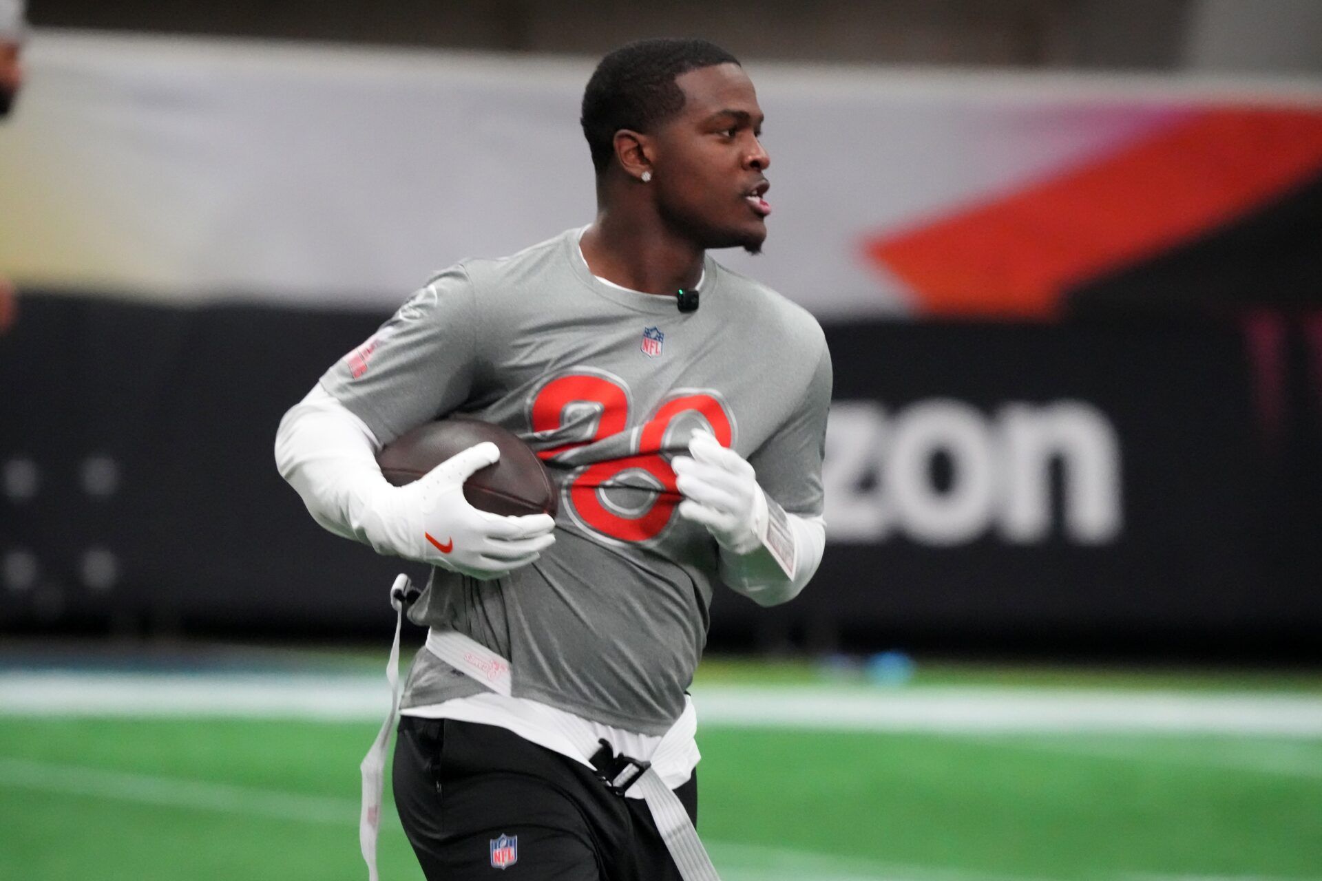 Miami Dolphins running back  De'Von Achane (28) carries the ball during AFC practice at the NFL Flag Fieldhouse at Moscone Center South Building.