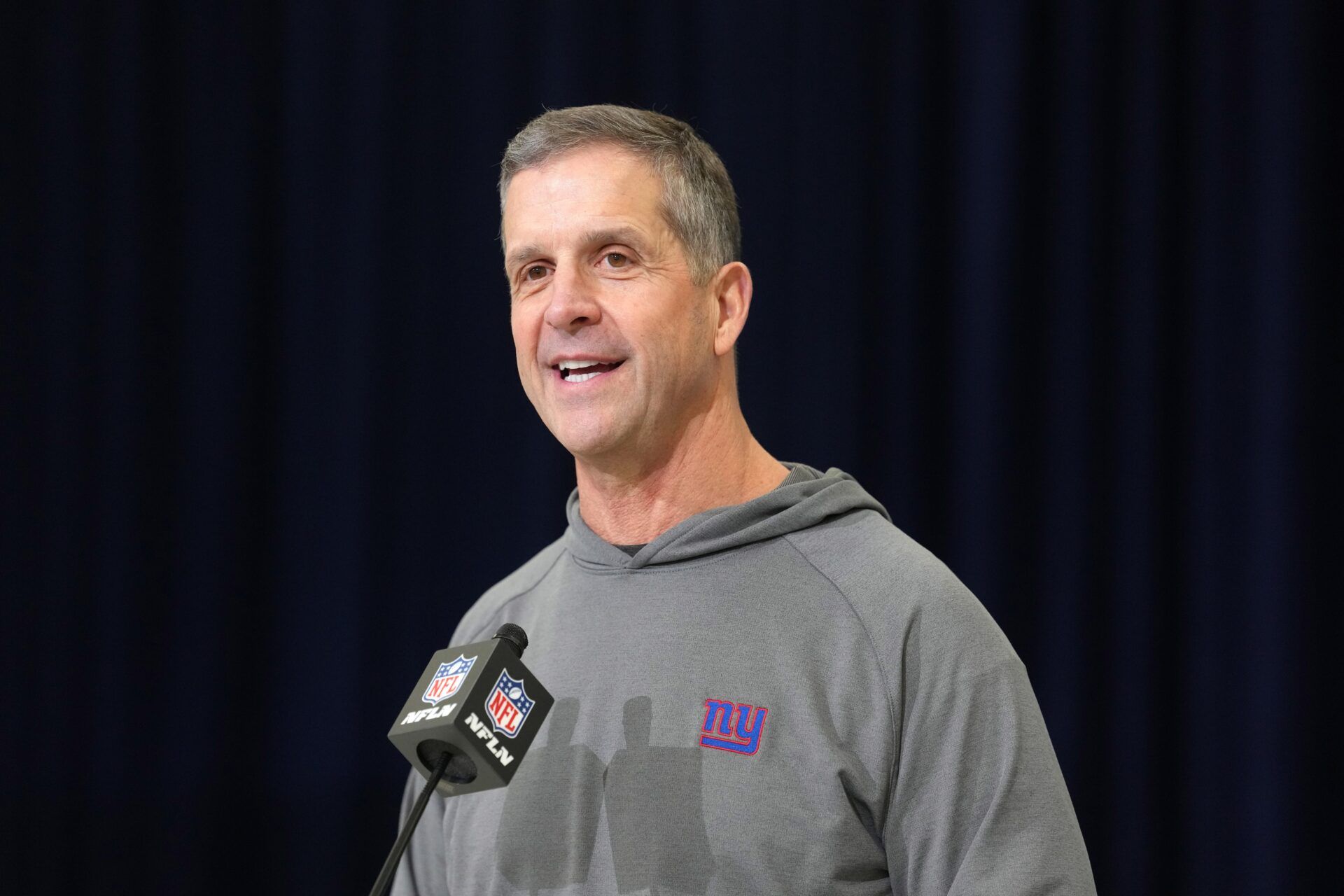 New York Giants coach John Harbaugh speaks at the NFL Scouting Combine at the Indiana Convention Center.