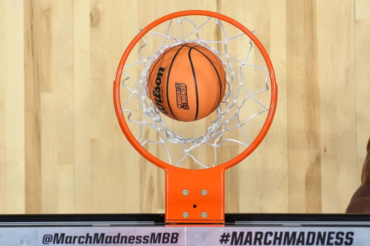 A general overall view of a Wilson Evo NXT basketball with the March Madness logo goes through the net during a first round game of the men's 2026 NCAA Tournament at Viejas Arena.