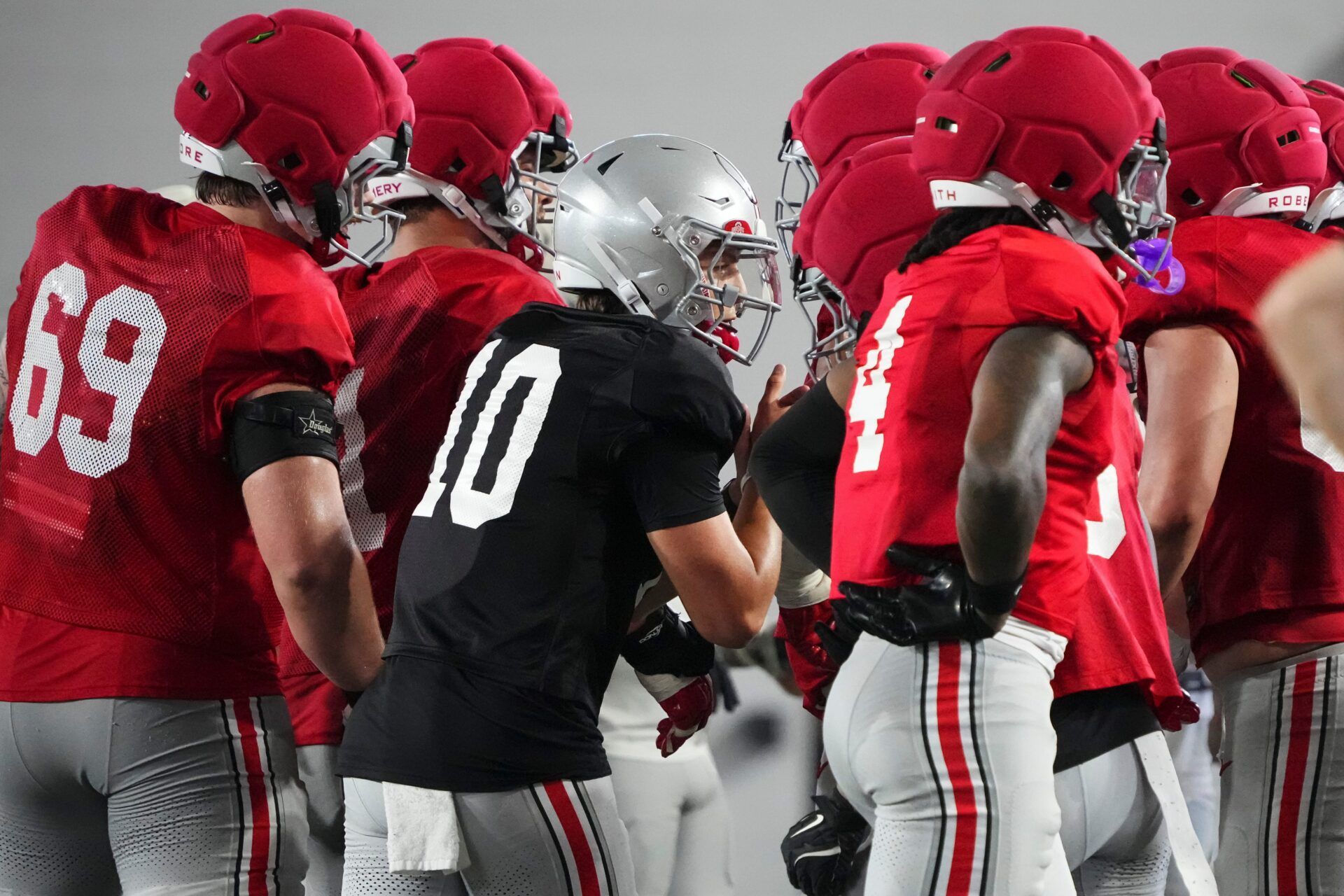 Ohio State Buckeyes quarterback Julian Sayin (10) talks to teammates in the huddle during Student Appreciation Day spring practice at the Woody Hayes Athletic Center on April 4, 2026.