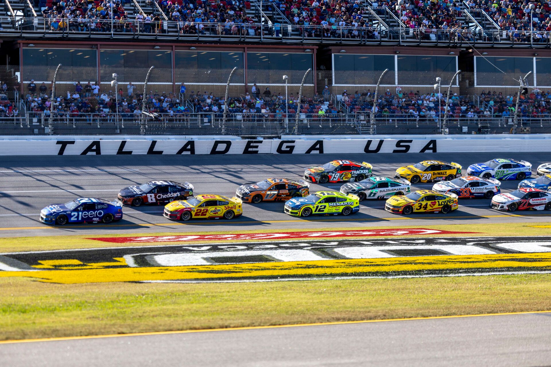 NASCAR Cup Series driver Josh Berry (21) leads Kyle Busch (8) and Joey Logano (22) during stage two of the YellaWood 500 at Talladega Superspeedway.