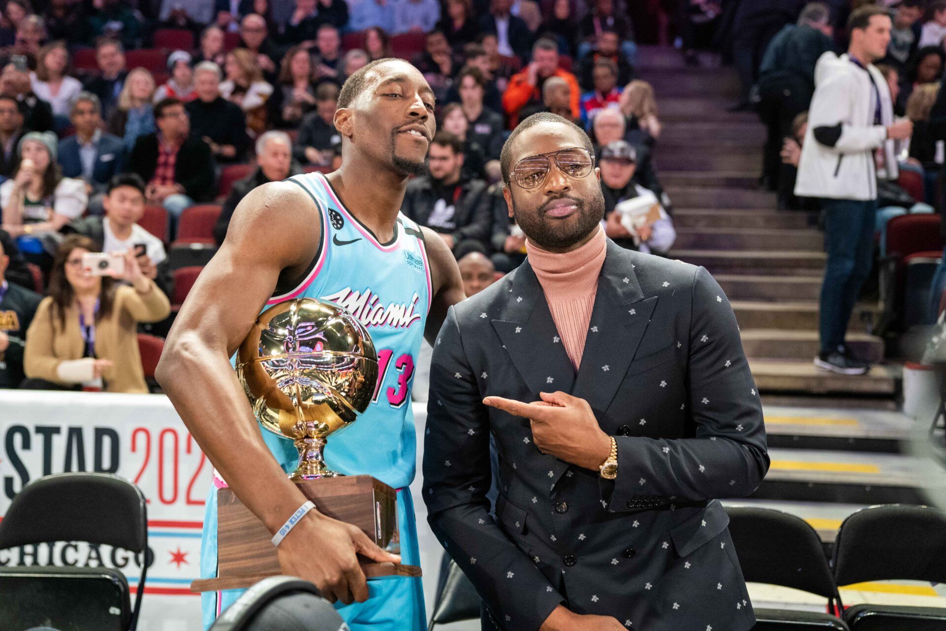 Miami Heat center Bam Adebayo (13) poses with former NBA player Dwyane Wade (right) after winning the skills challenge during NBA All Star Saturday Night at United Center.