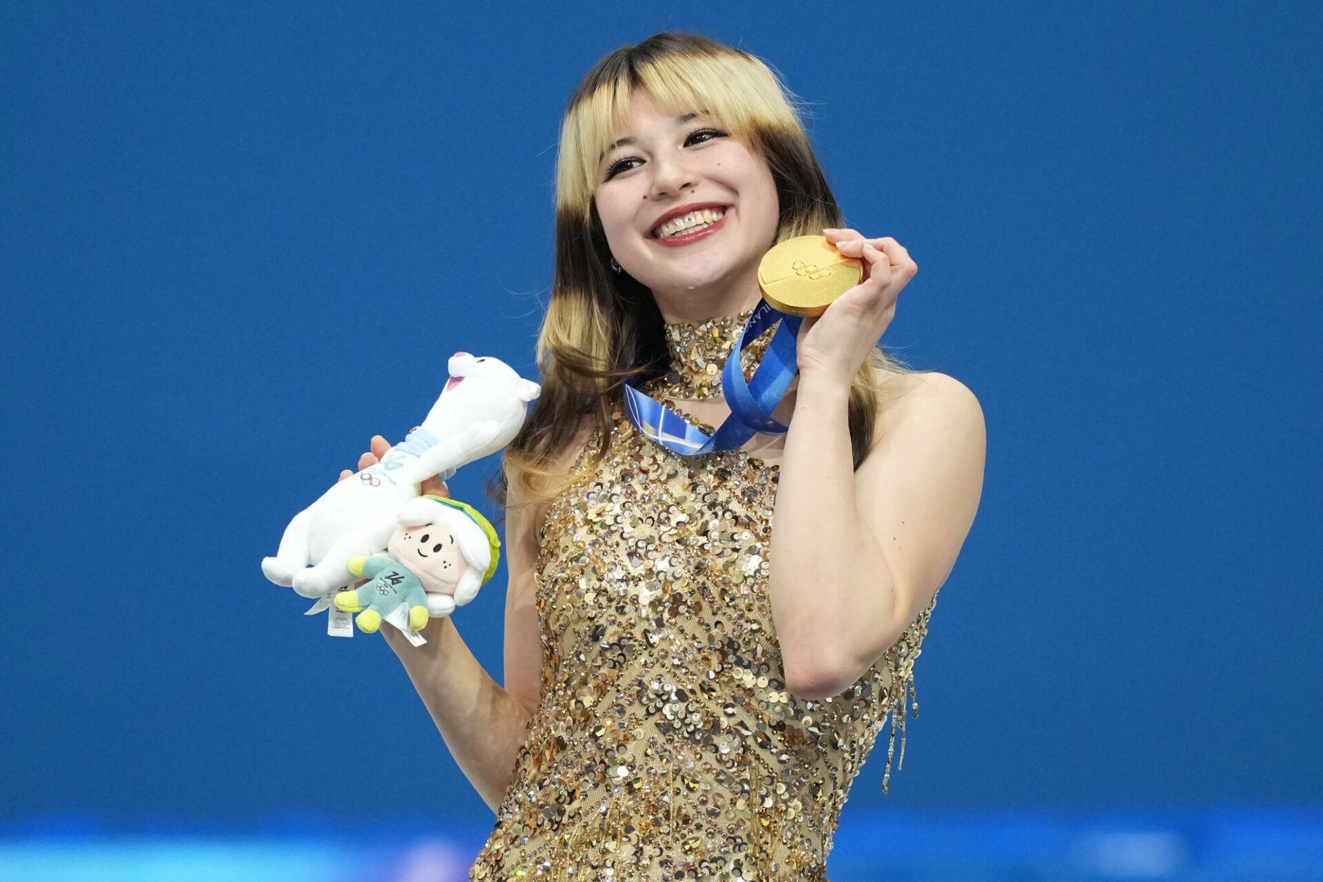 Alysa Liu of the United States celebrates with the gold medal in the women's free skate during the Milano Cortina 2026 Olympic Winter Games at Milano Ice Skating Arena.