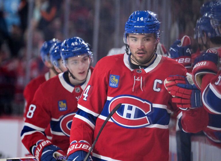 Montreal Canadiens forward Nick Suzuki (14) celebrates with teammates after scoring a goal against the Florida Panthers during the third period at the Bell Centre.