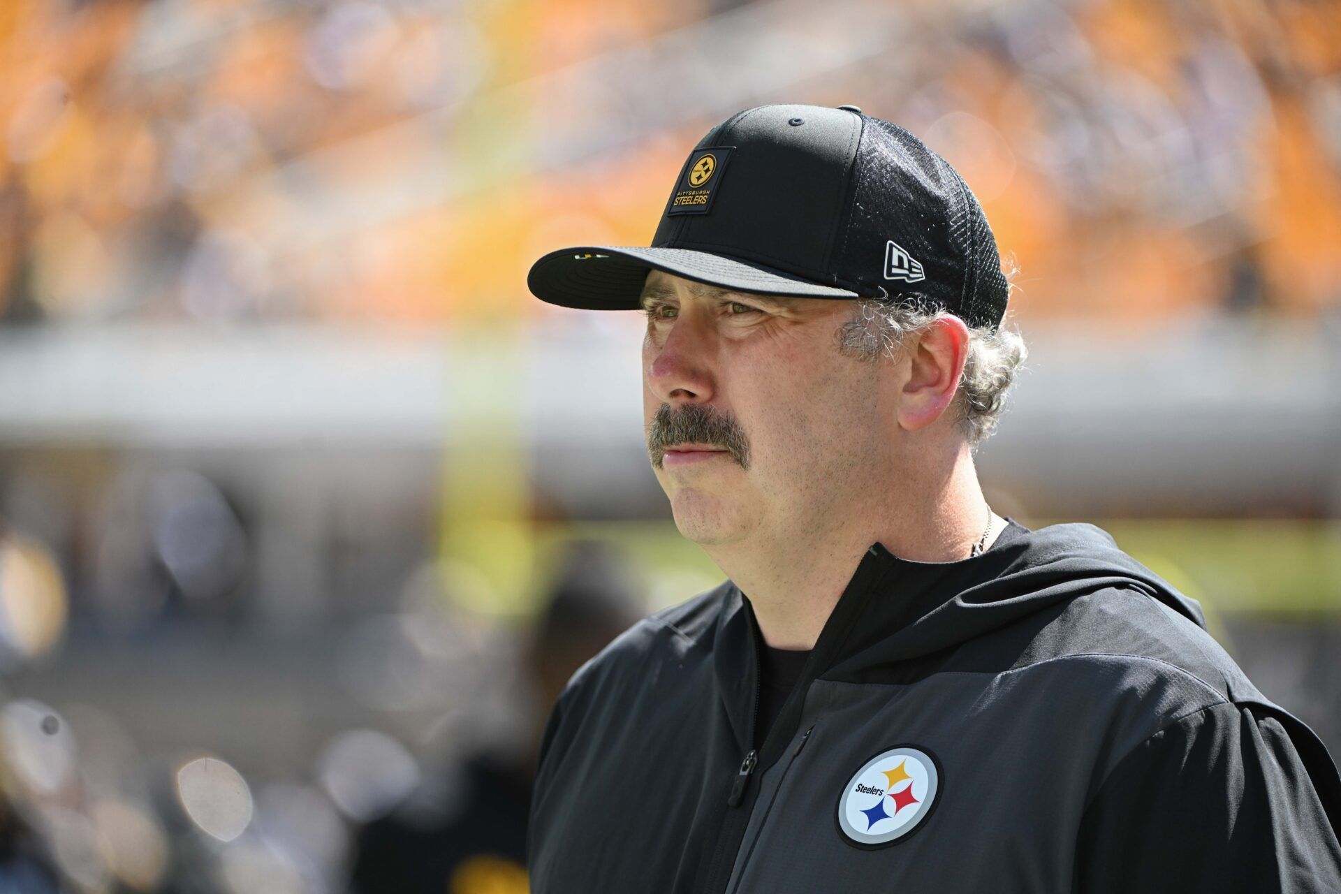 Pittsburgh Steelers offensive coordinator Arthur Smith  walks the sideline before a game against the Seattle Seahawks at Acrisure Stadium.