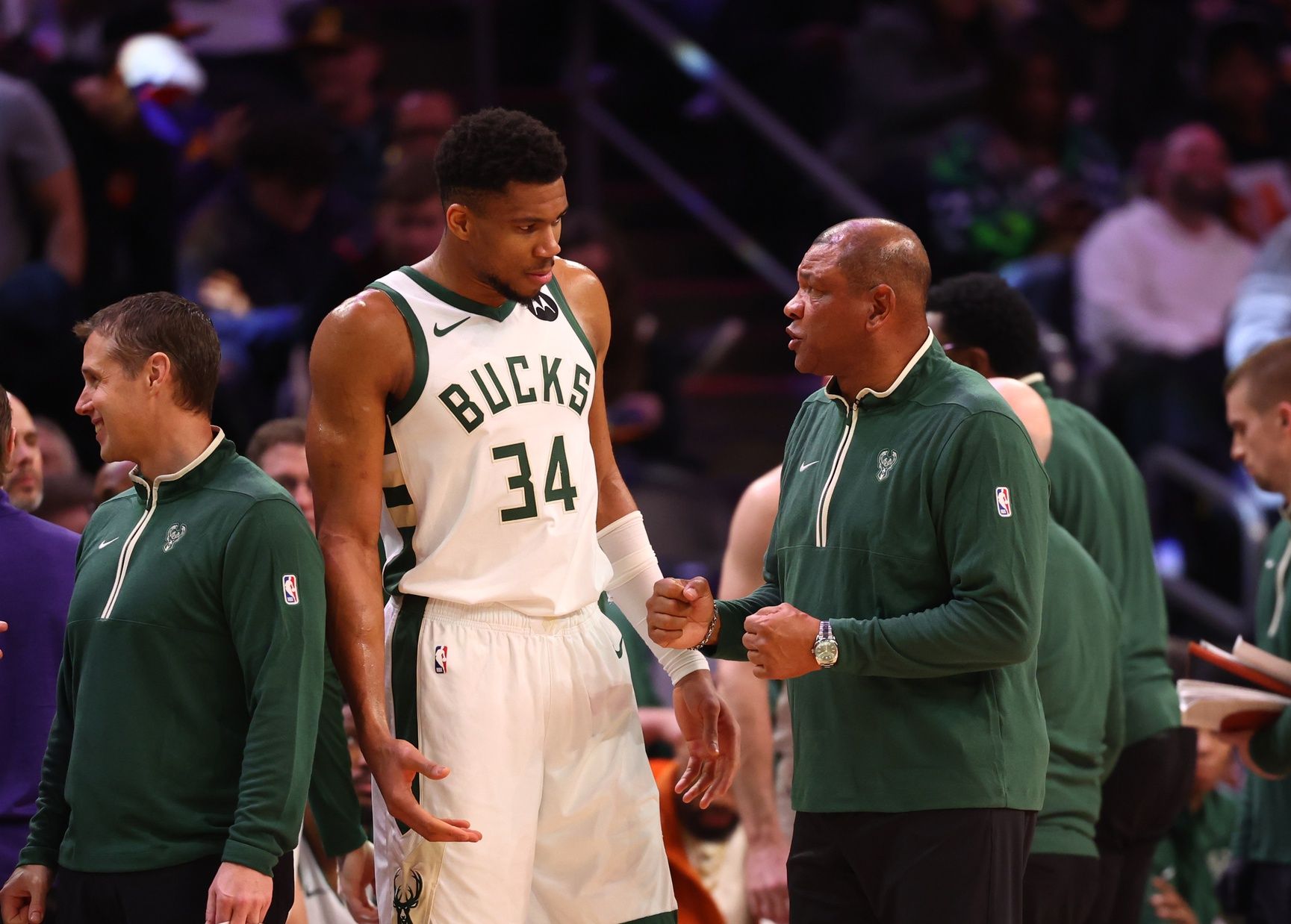 Milwaukee Bucks head coach Doc Rivers talks to forward Giannis Antetokounmpo (34) against the Phoenix Suns at Footprint Center.