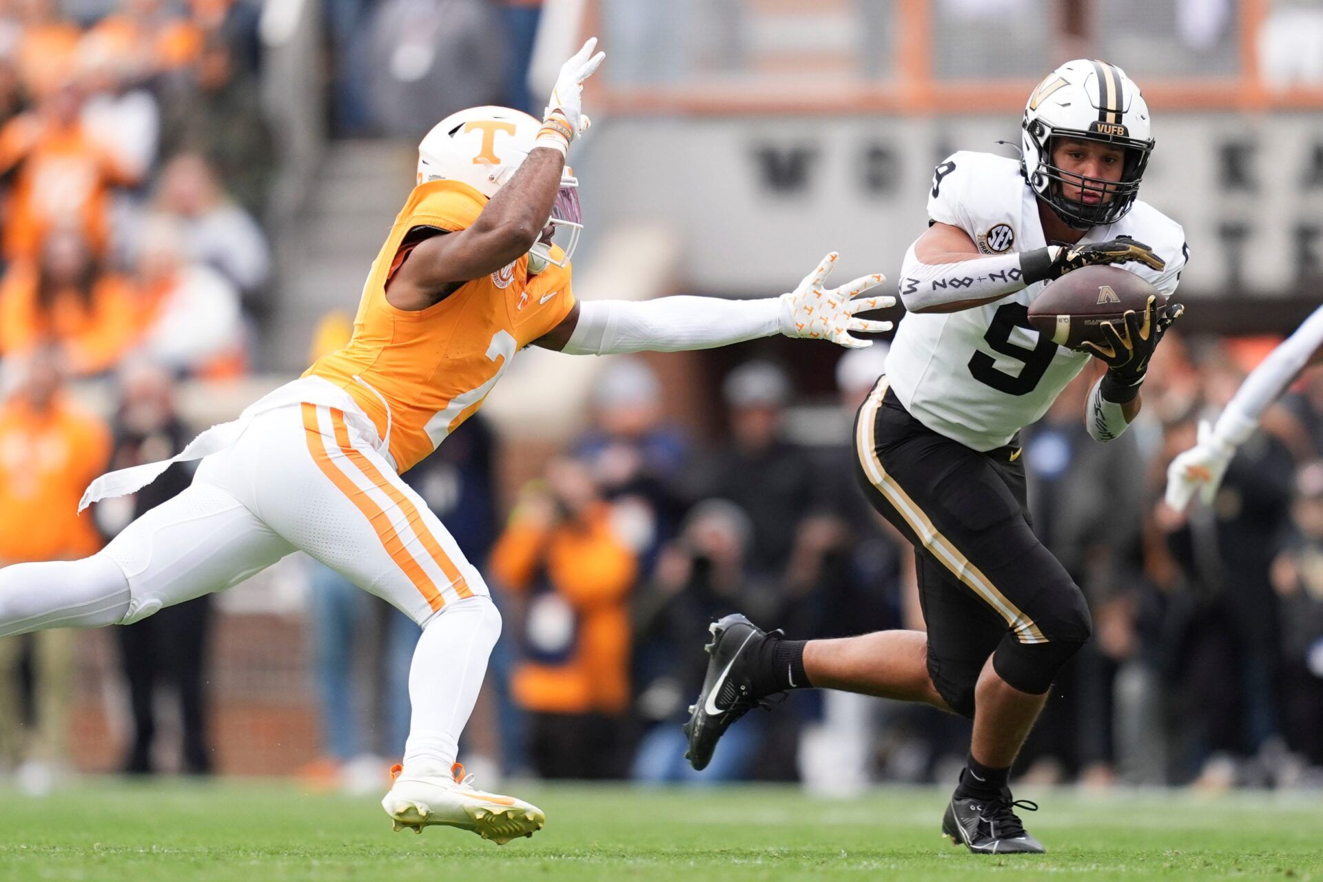 Vanderbilt tight end Eli Stowers (9) makes the catch under coverable by Tennessee defensive back Andre Turrentine (2) in an NCAA college football game in Nov. 29, 2025, in Knoxville, Tennessee.