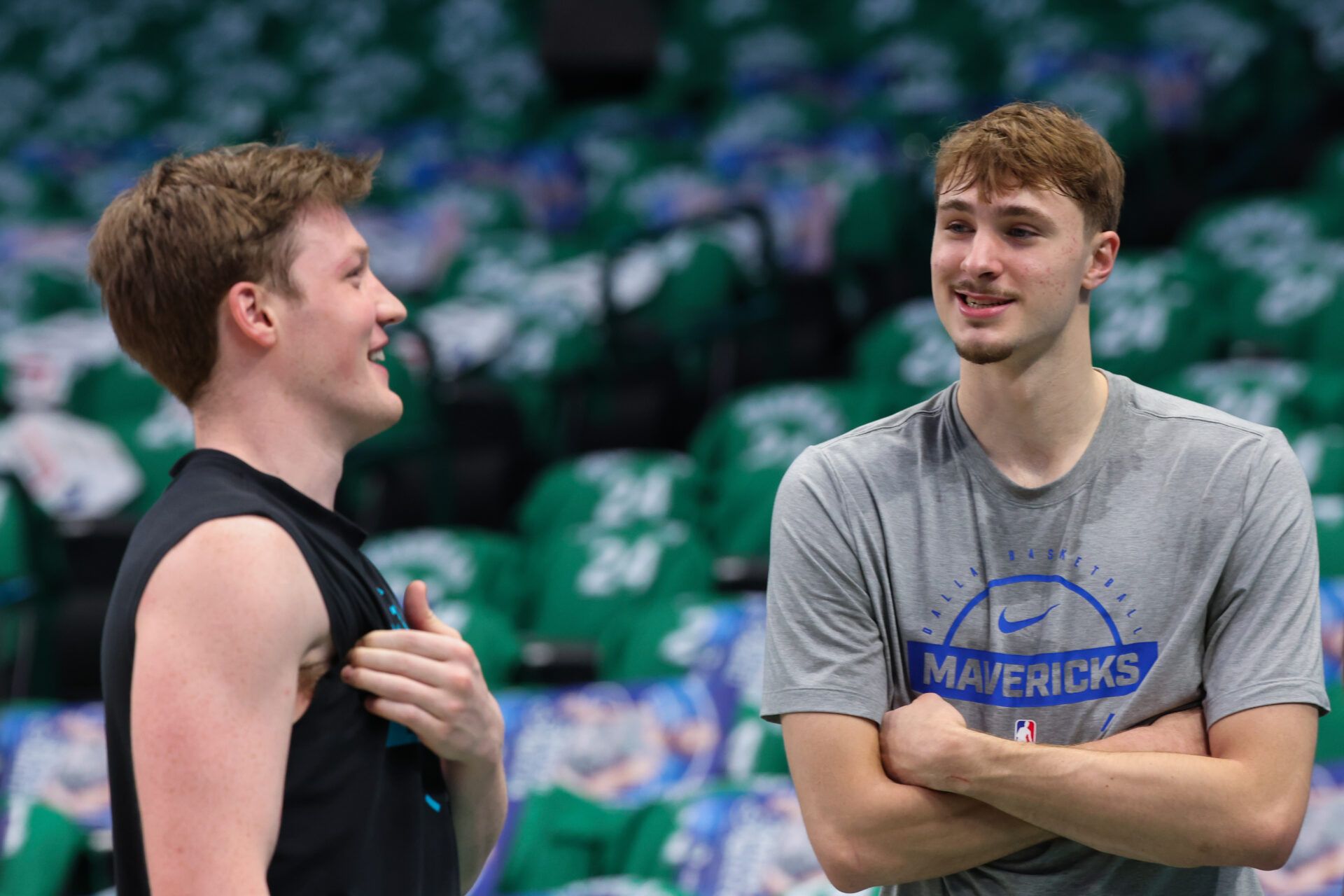 Dallas Mavericks forward Cooper Flagg (right) speaks with Charlotte Hornets guard Kon Knueppel (left) before the game at American Airlines Center.