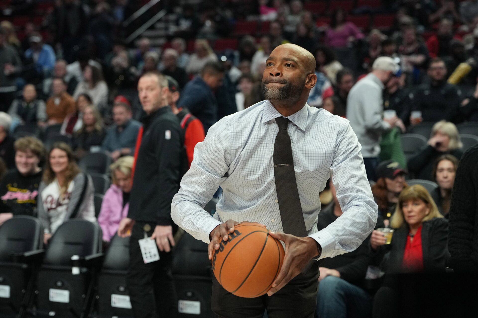 Former NBA player Vince Carter shoots during halftime between the Portland Trail Blazers and the Minnesota Timberwolvesat Moda Center.