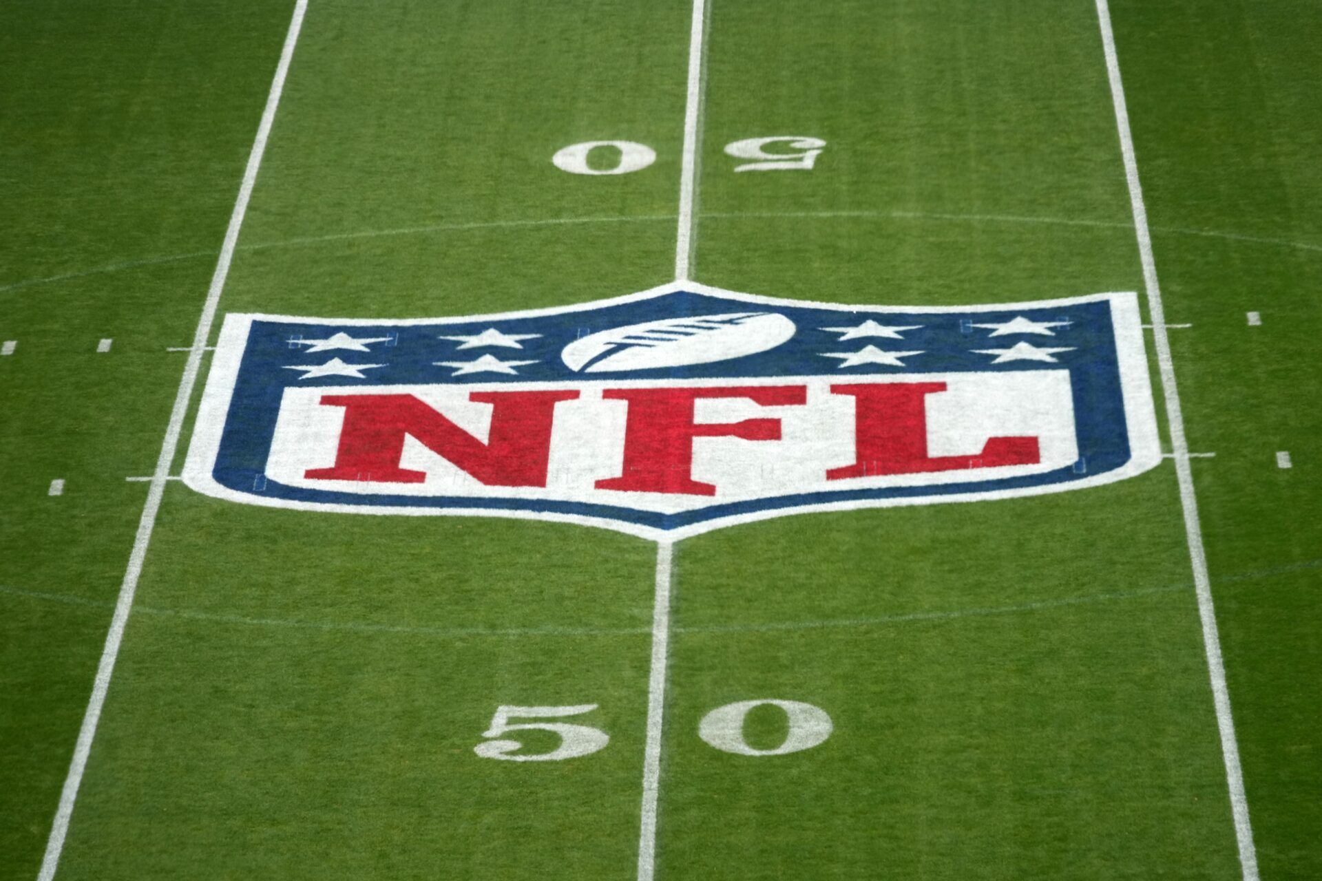 The NFL shield logo at midfield at the NFL Berlin Game at Olympic Stadium.