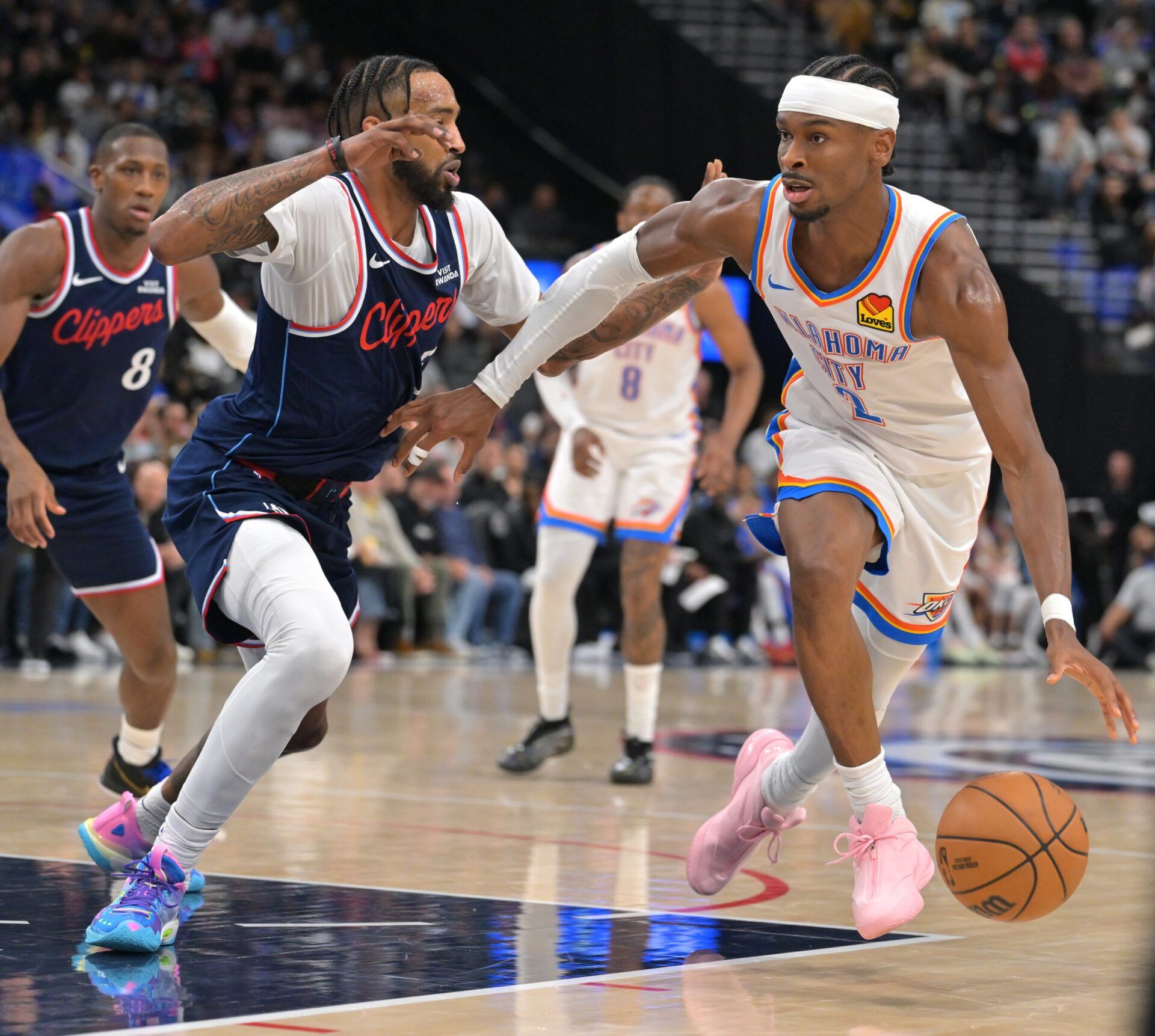 Oklahoma City Thunder guard Shai Gilgeous-Alexander (2) is defended by Los Angeles Clippers forward Derrick Jones Jr. (5) in the second half at Intuit Dome.
