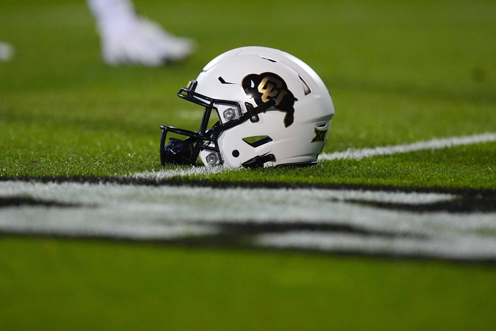 General view of a Colorado Buffaloes helmet on the turf of before the game Folsom Field against the Cincinnati Bearcats.