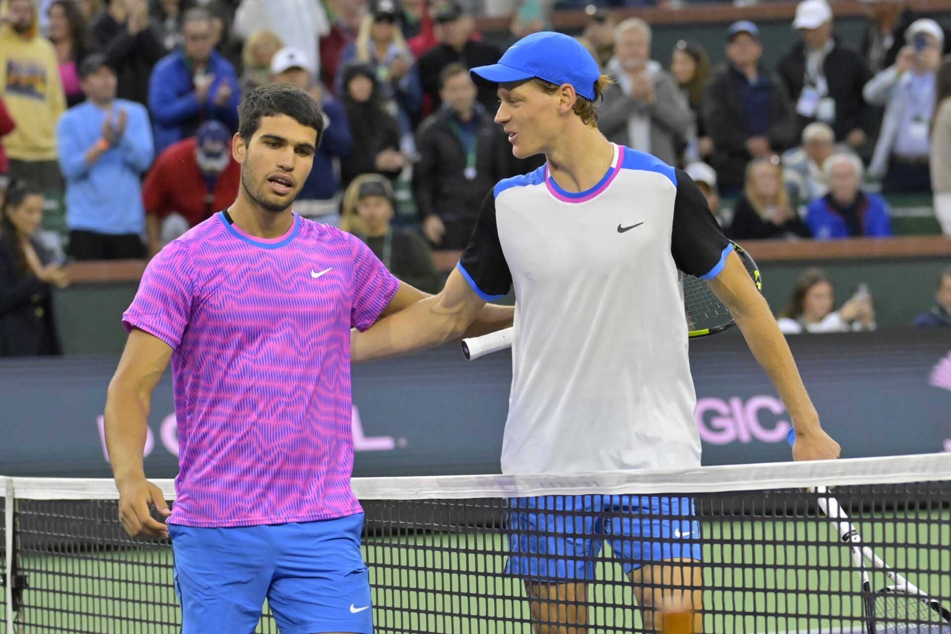 Carlos Alcaraz (ESP) is congratulated by Jannik Sinner (POL) after winning their semi-final match in the BNP Paribas Open at the Indian Wells Tennis Garden.