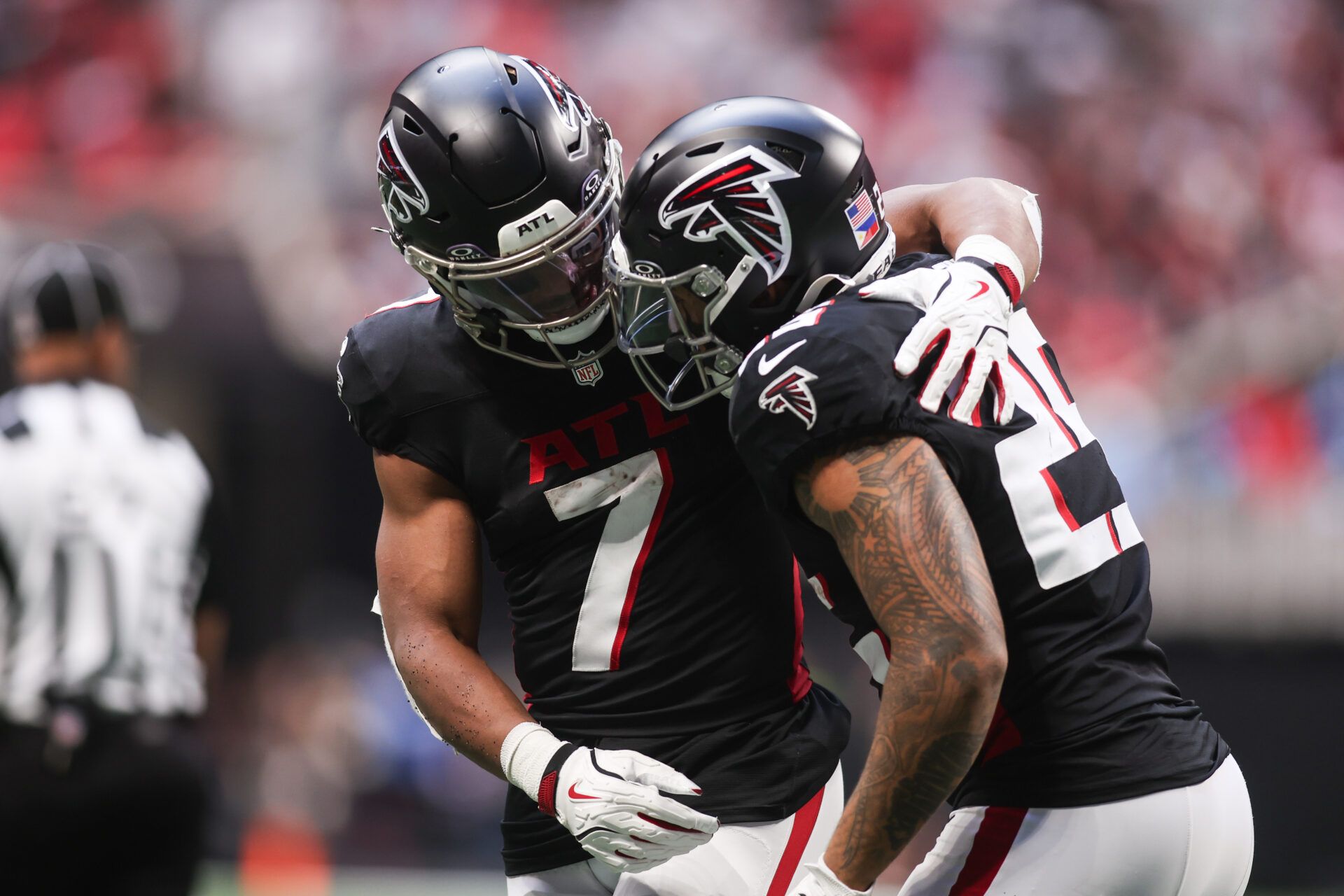 Atlanta Falcons running back Bijan Robinson (7) and running back Tyler Allgeier (25) celebrated a touchdown in the second quarter at Mercedes-Benz Stadium.