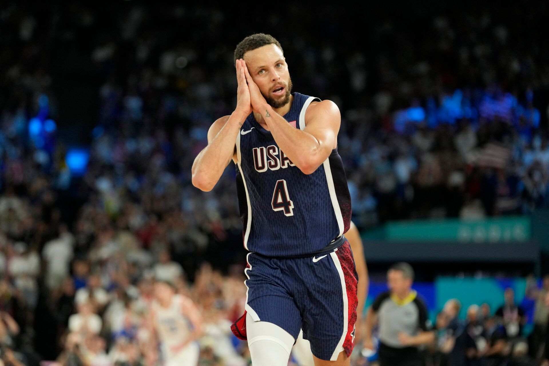 United States shooting guard Stephen Curry (4) reacts in the second half against France in the men's basketball gold medal game during the Paris 2024 Olympic Summer Games at Accor Arena.