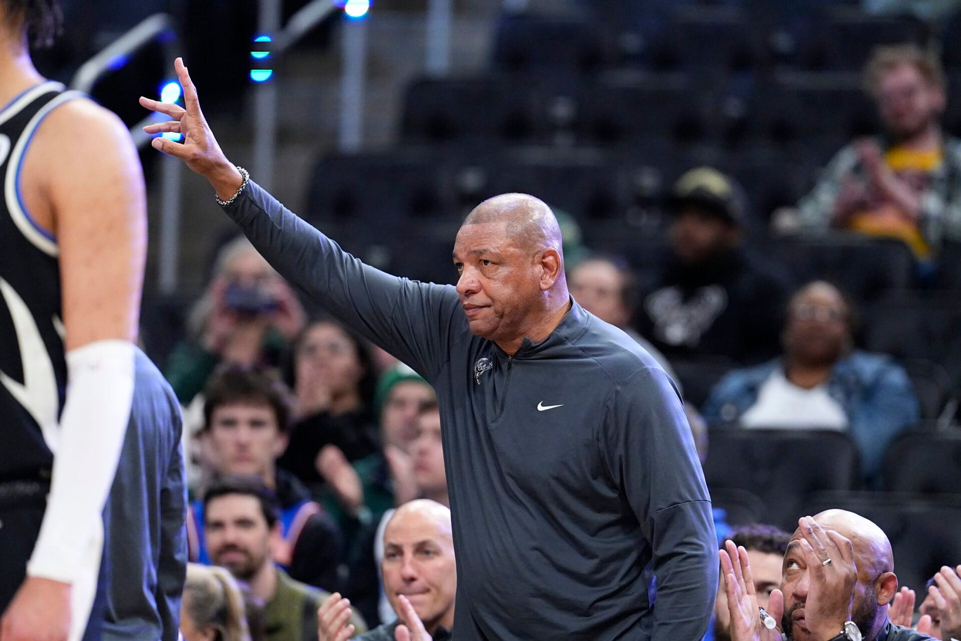 Milwaukee Bucks coach Doc Rivers acknowledges the fan as they clap for his announcement as being inducted into the NBA Hall of Fame during a game against the Memphis Grizzlies at Fiserv Forum.