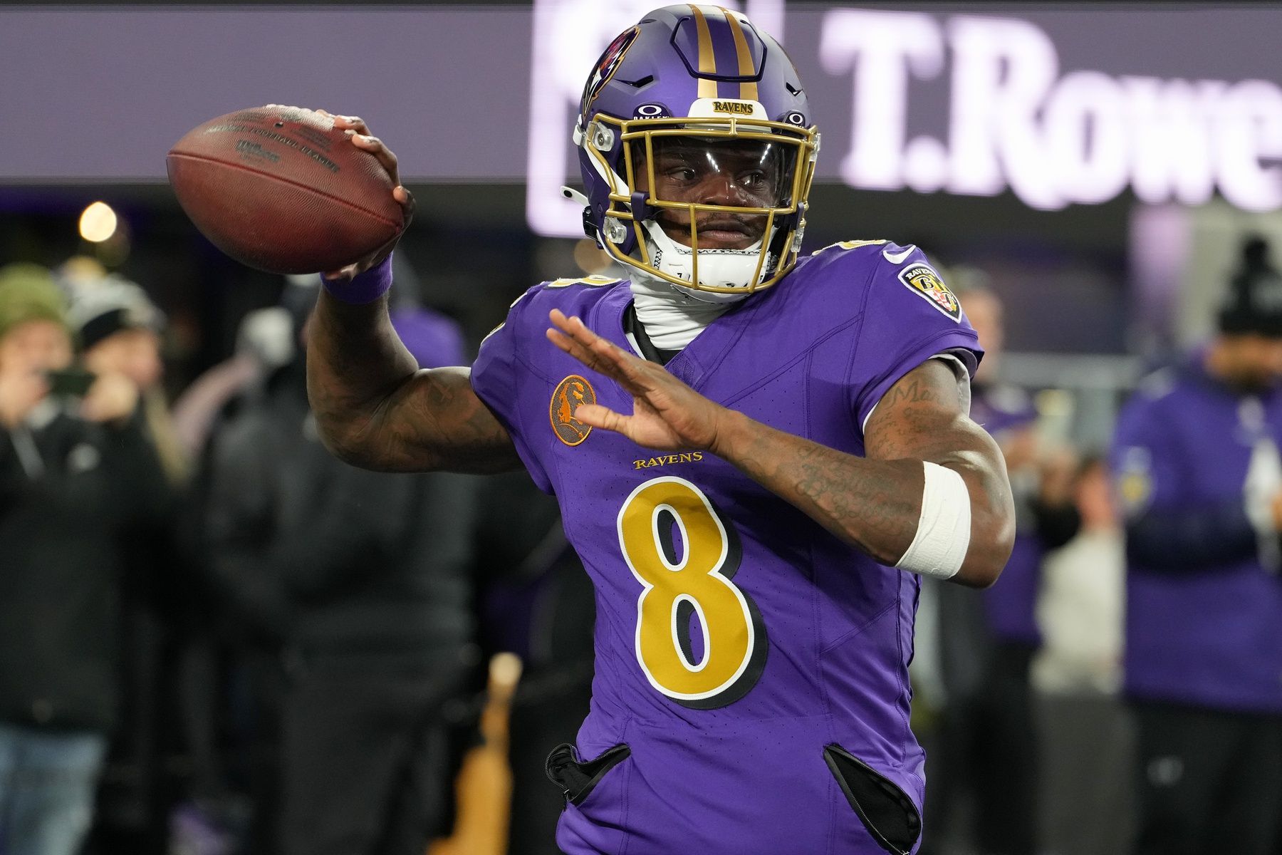Baltimore Ravens quarterback Lamar Jackson (8) practices before the game at M&T Bank Stadium.
